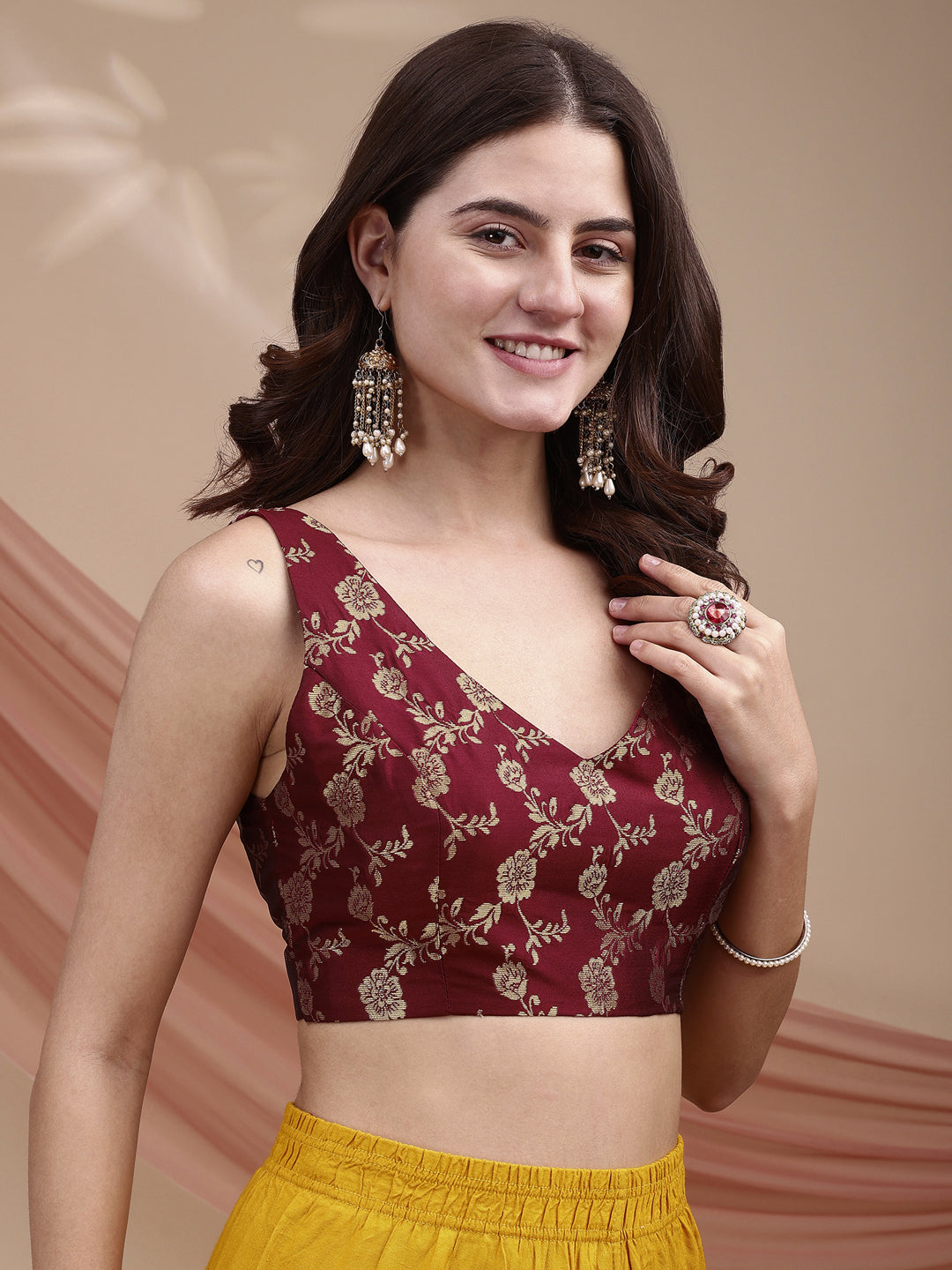 Maroon colour brocade sleeveless blouse