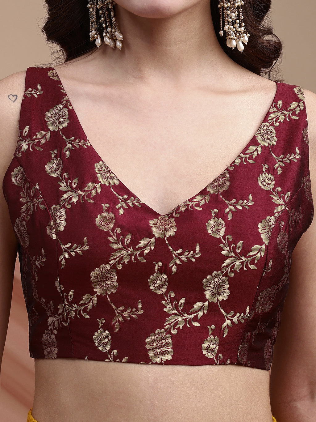 Maroon colour brocade sleeveless blouse