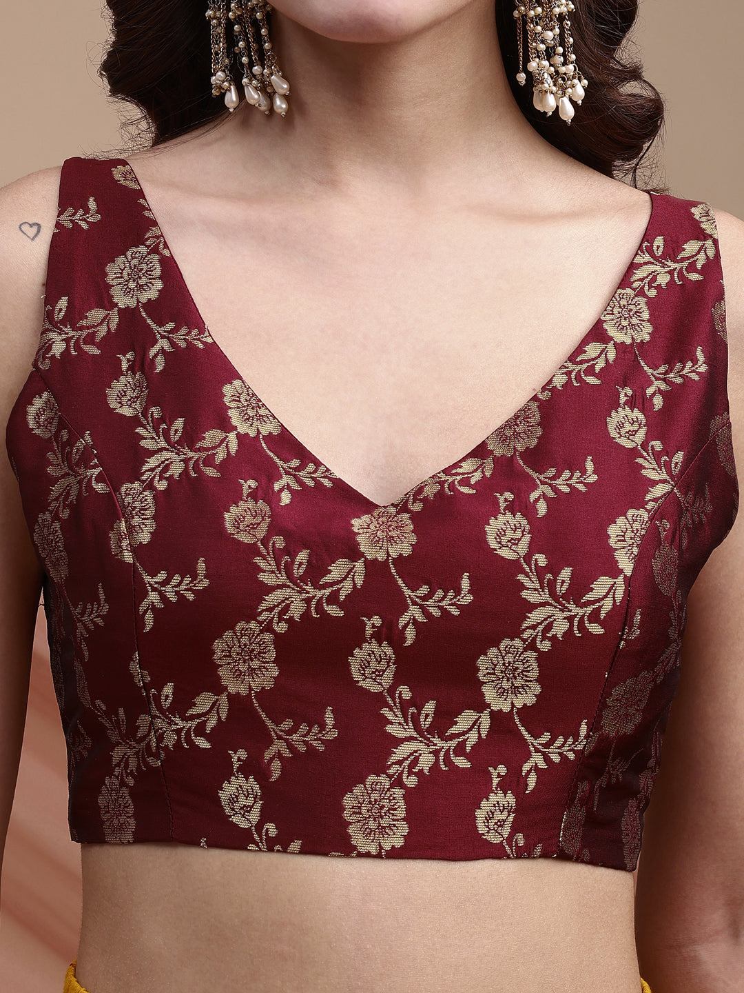 Maroon colour brocade sleeveless blouse