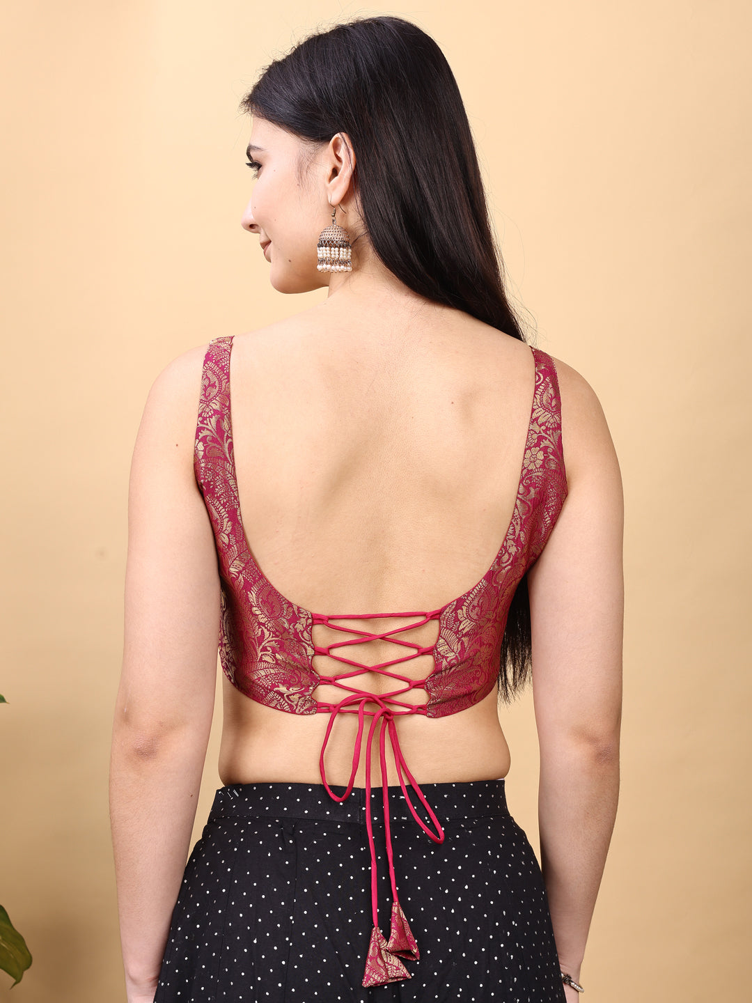 Pink colored jacquard corset blouse with tie up at back