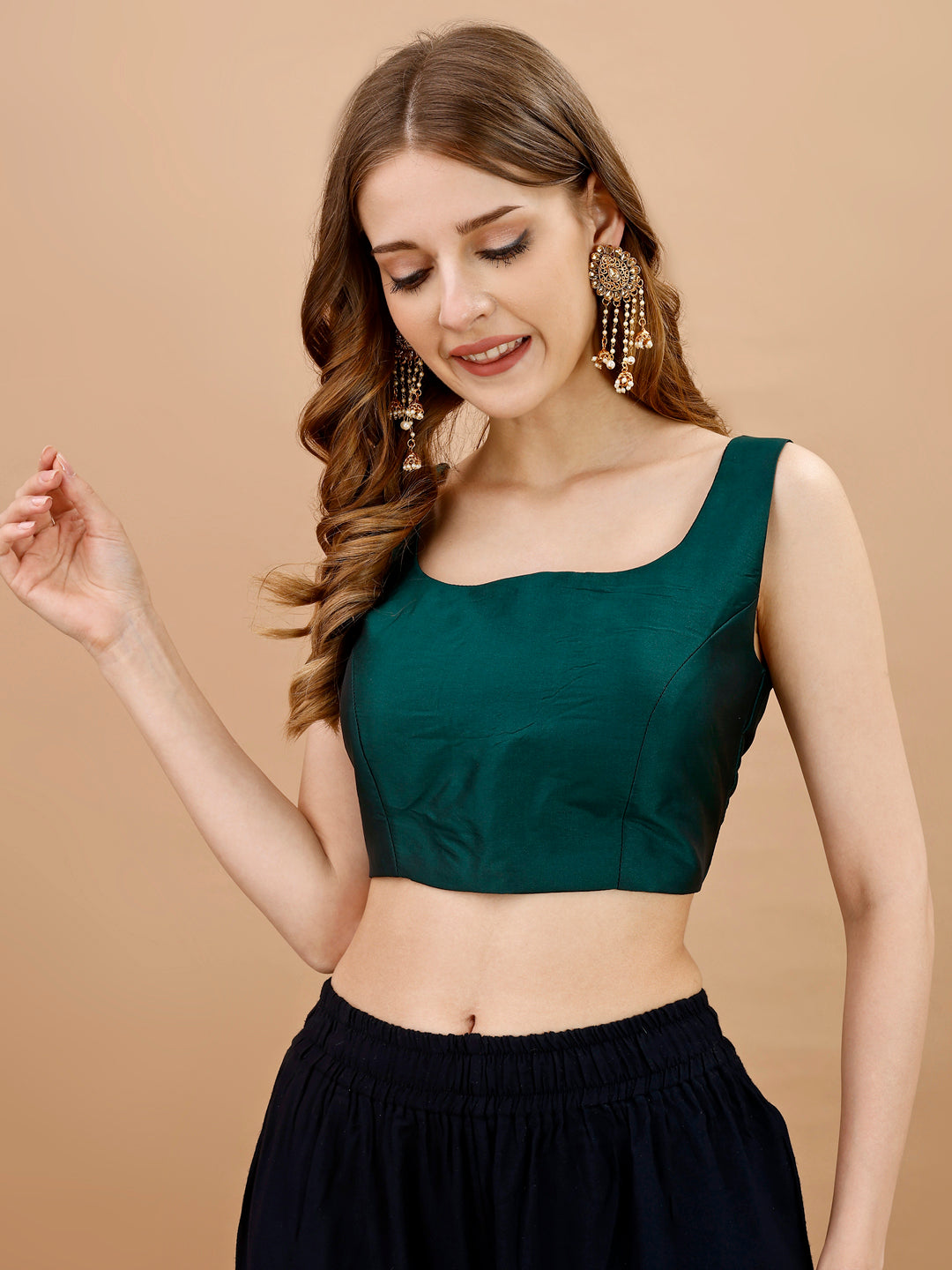 Green colored sleeveless tafeta blouse