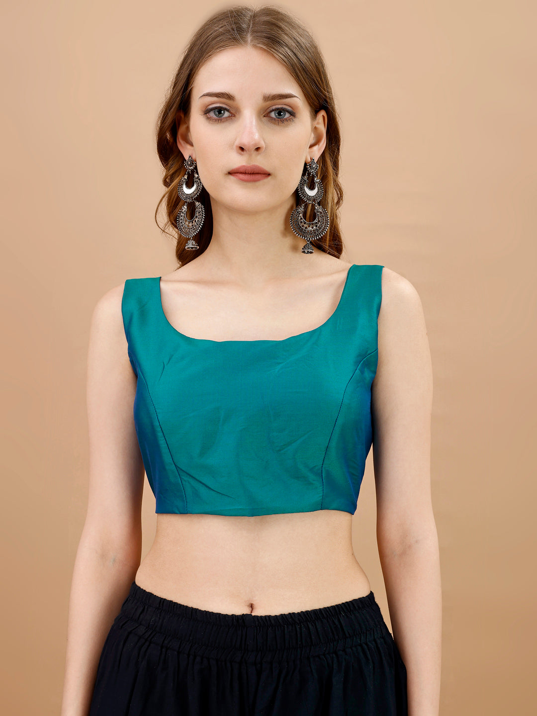 Teal colored sleeveless tafeta blouse