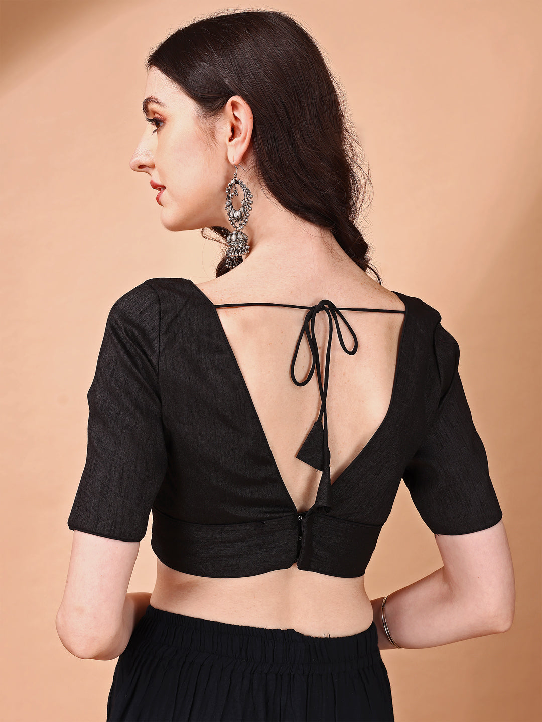 Black colored half sleeves v neck blouse