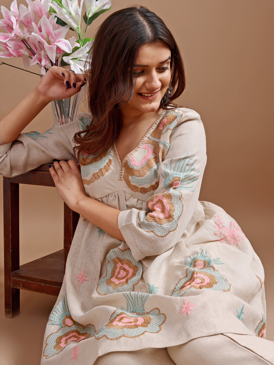 Beige colour linen multi thread embroidery flared tunic with trouser coord set