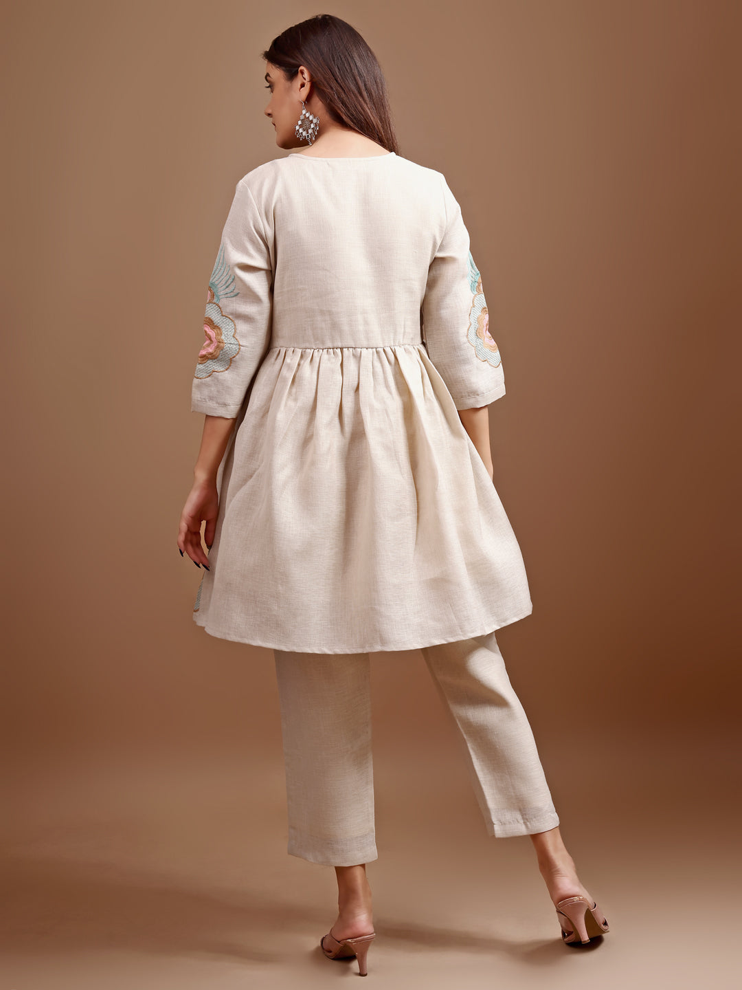 Beige colour linen multi thread embroidery flared tunic with trouser coord set