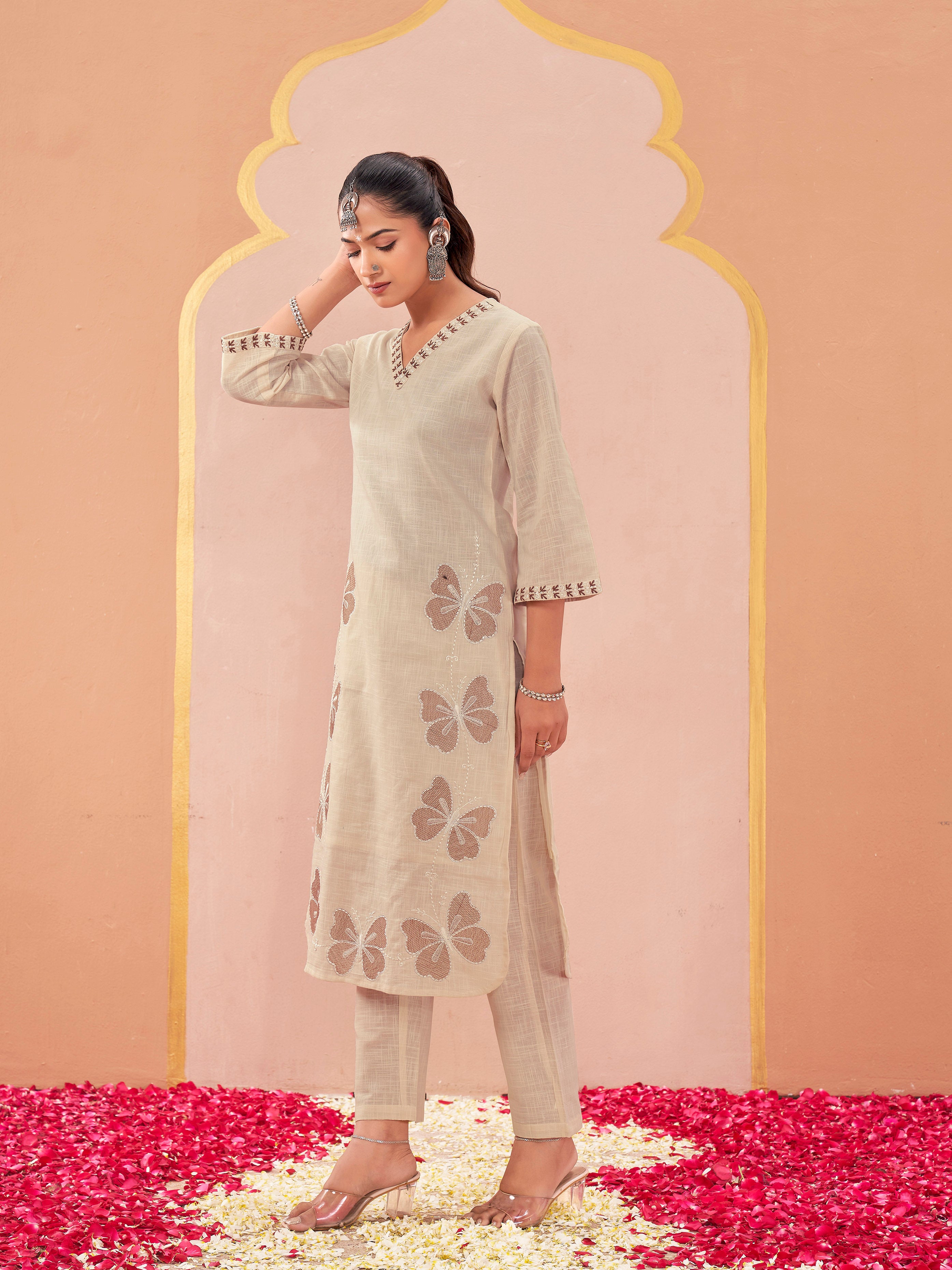 off-white color linen with contrast thread butterfly embroidered kurta and trouser co-ord set