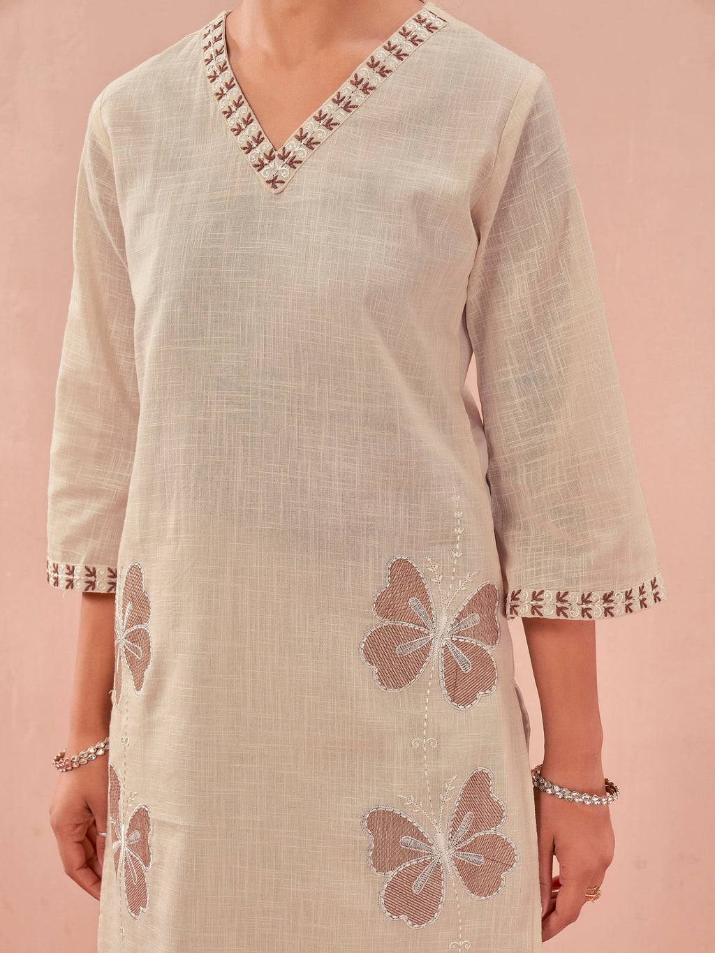 off-white color linen with contrast thread butterfly embroidered kurta and trouser co-ord set