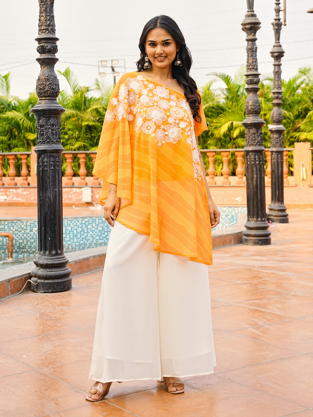 Orange color printed georgette with thread & sequinned embroidered up & down top & A-line plazzo co-ords set