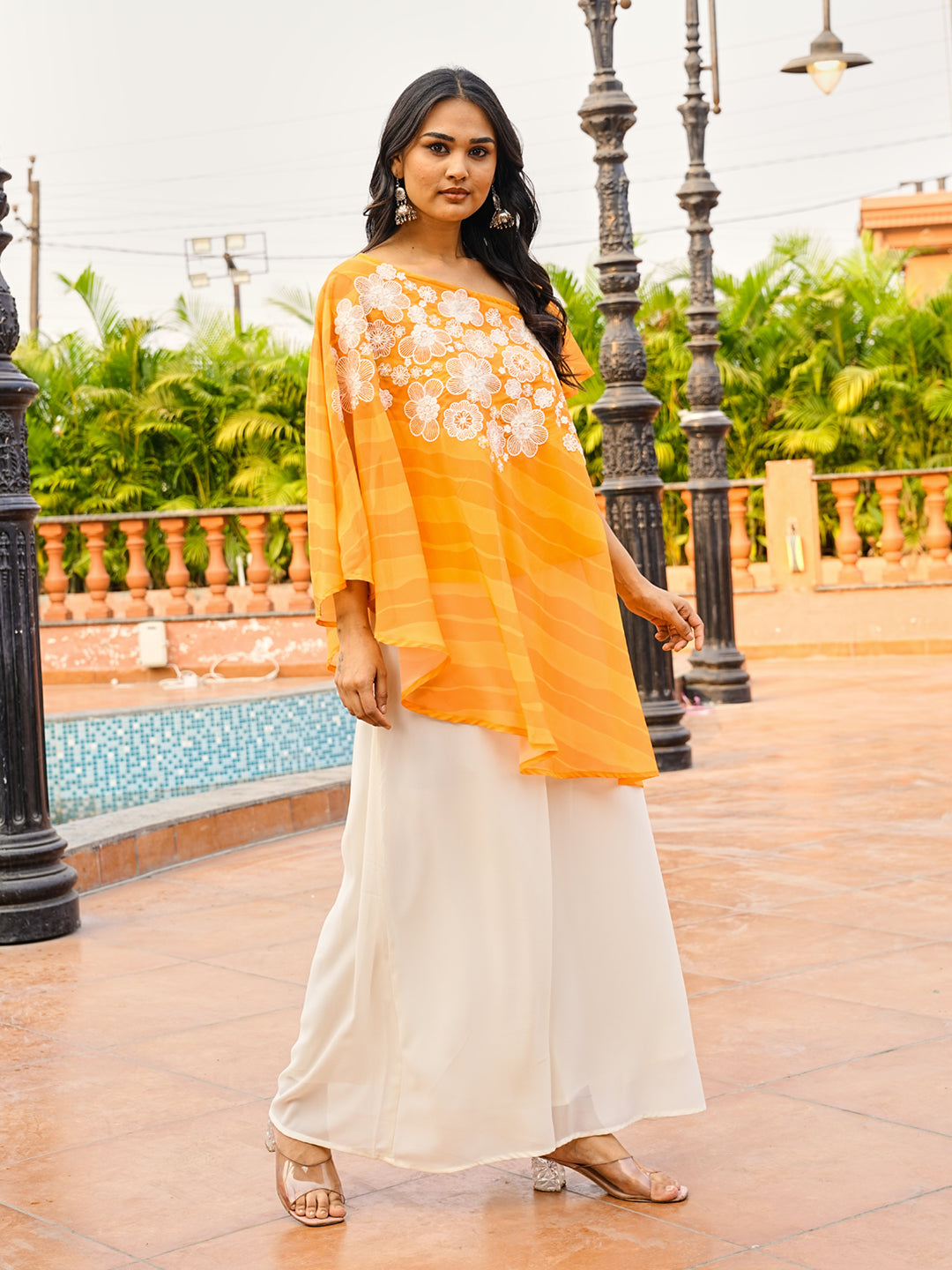 Orange color printed georgette with thread & sequinned embroidered up & down top & A-line plazzo co-ords set