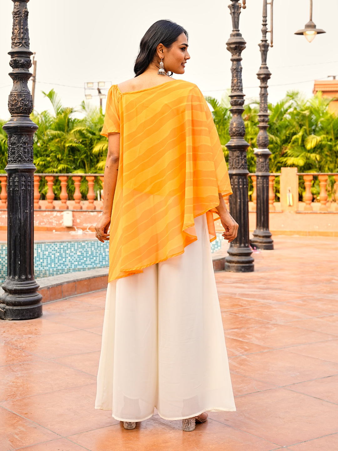 Orange color printed georgette with thread & sequinned embroidered up & down top & A-line plazzo co-ords set