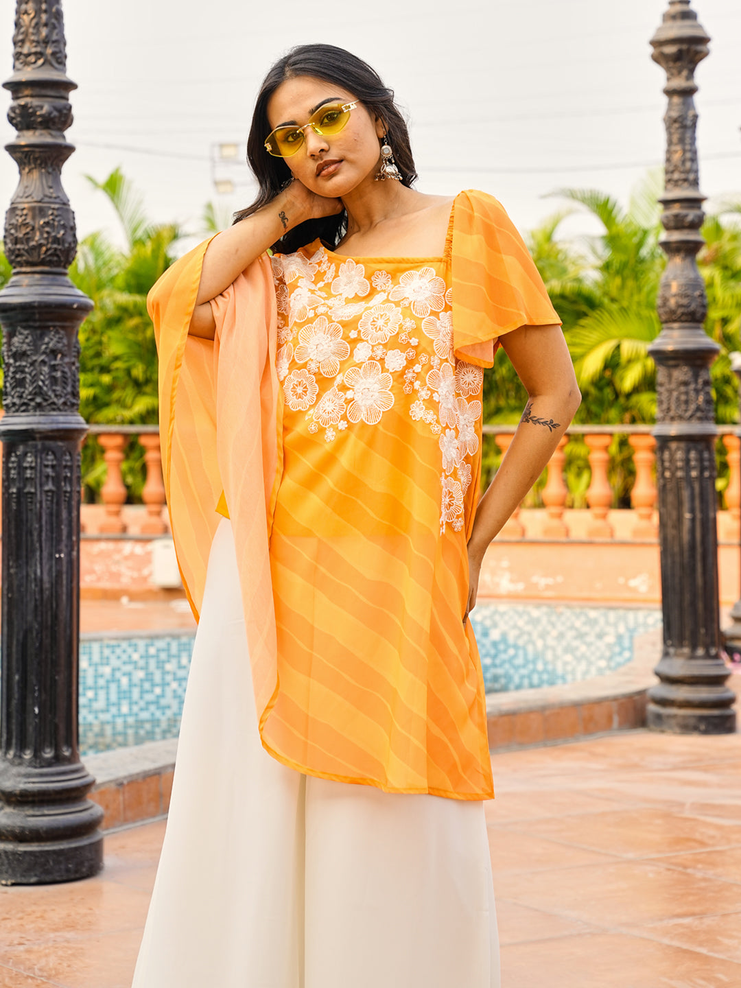 Orange color printed georgette with thread & sequinned embroidered up & down top & A-line plazzo co-ords set