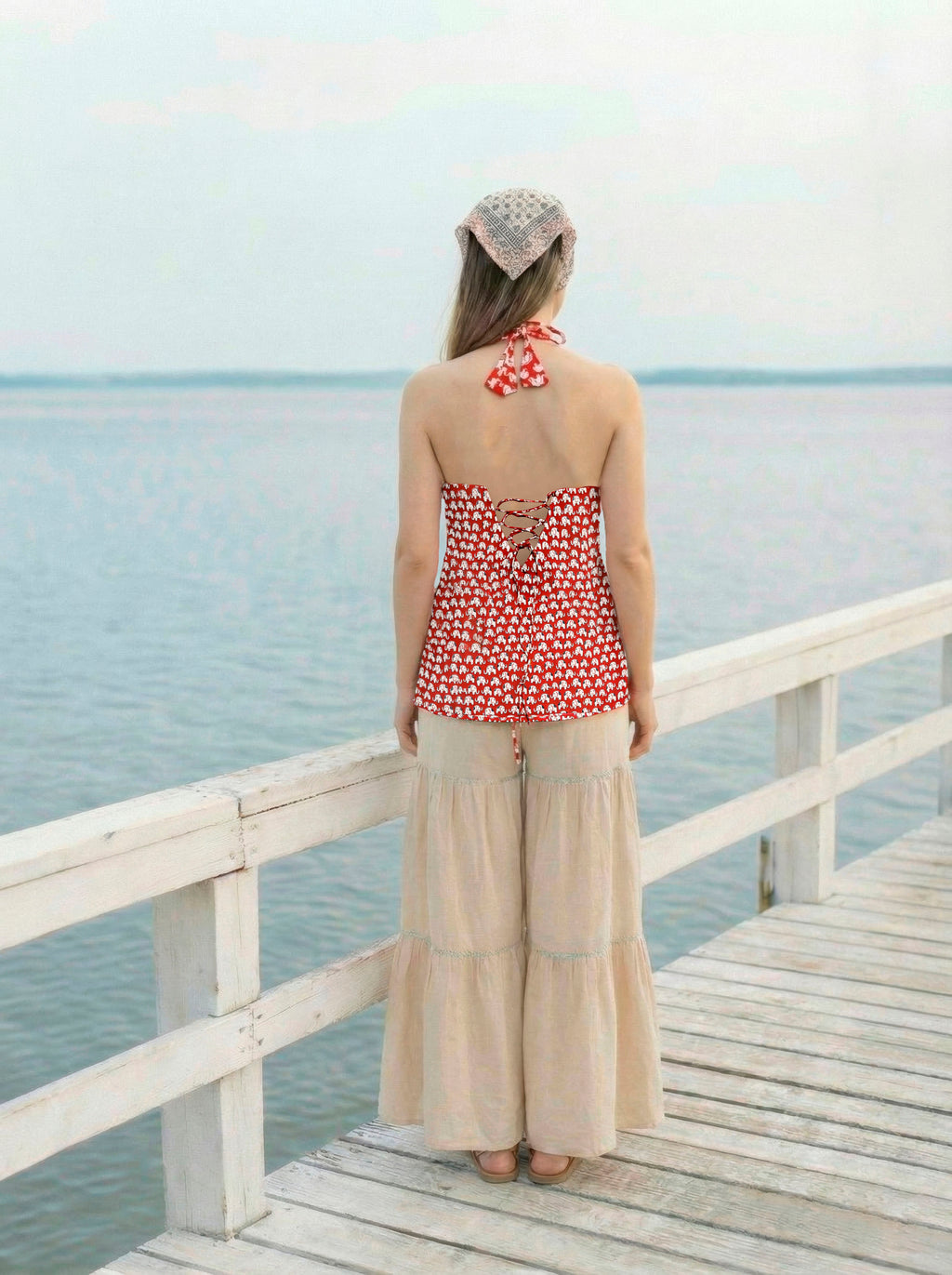 Sleeveless Halter Neck Red Kurti with Sharara and Stylised Back Dori Design