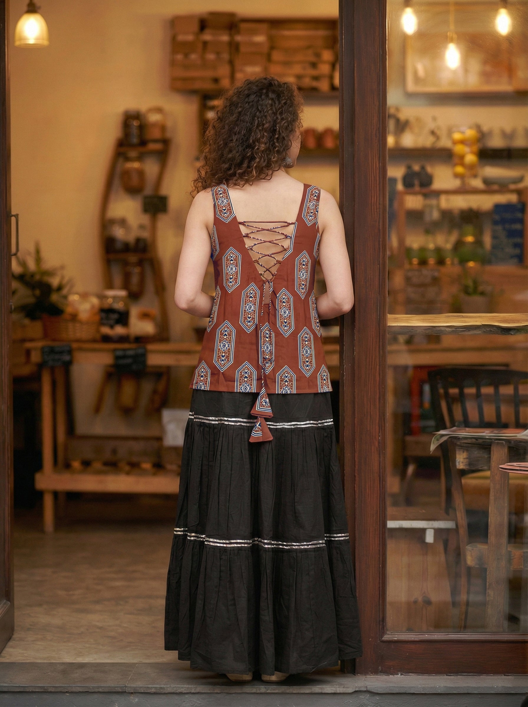 Sleeveless Red Cotton Kurti with Layered Gotta Patti Skirt and stylised Back Dori Design