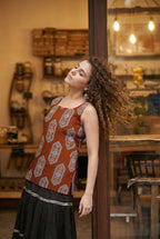 Sleeveless Red Cotton Kurti with Layered Gotta Patti Skirt and stylised Back Dori Design