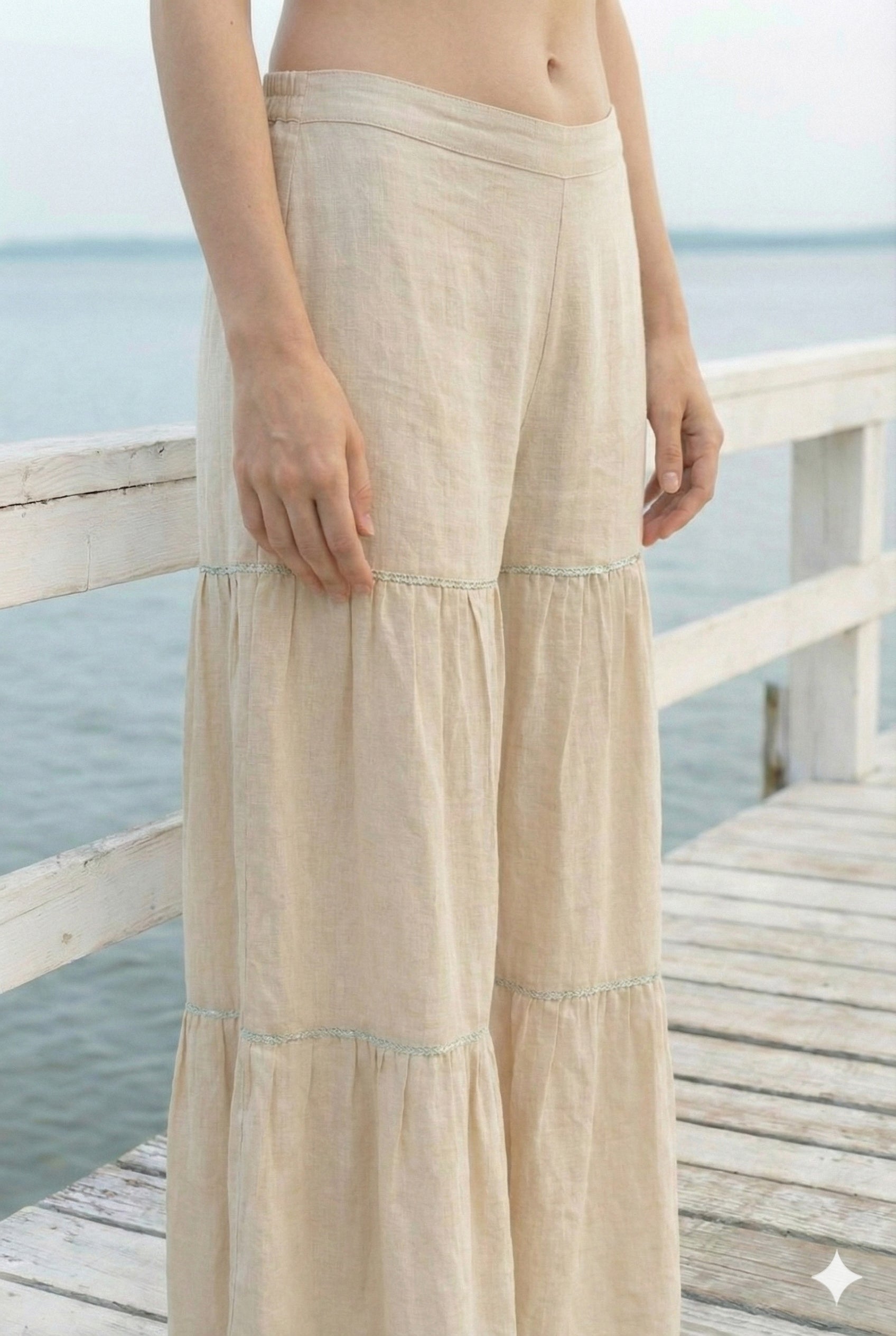 Sleeveless Black Cotton Kurti with Layered Gotta Patti Skirt and stylised Back Dori Design