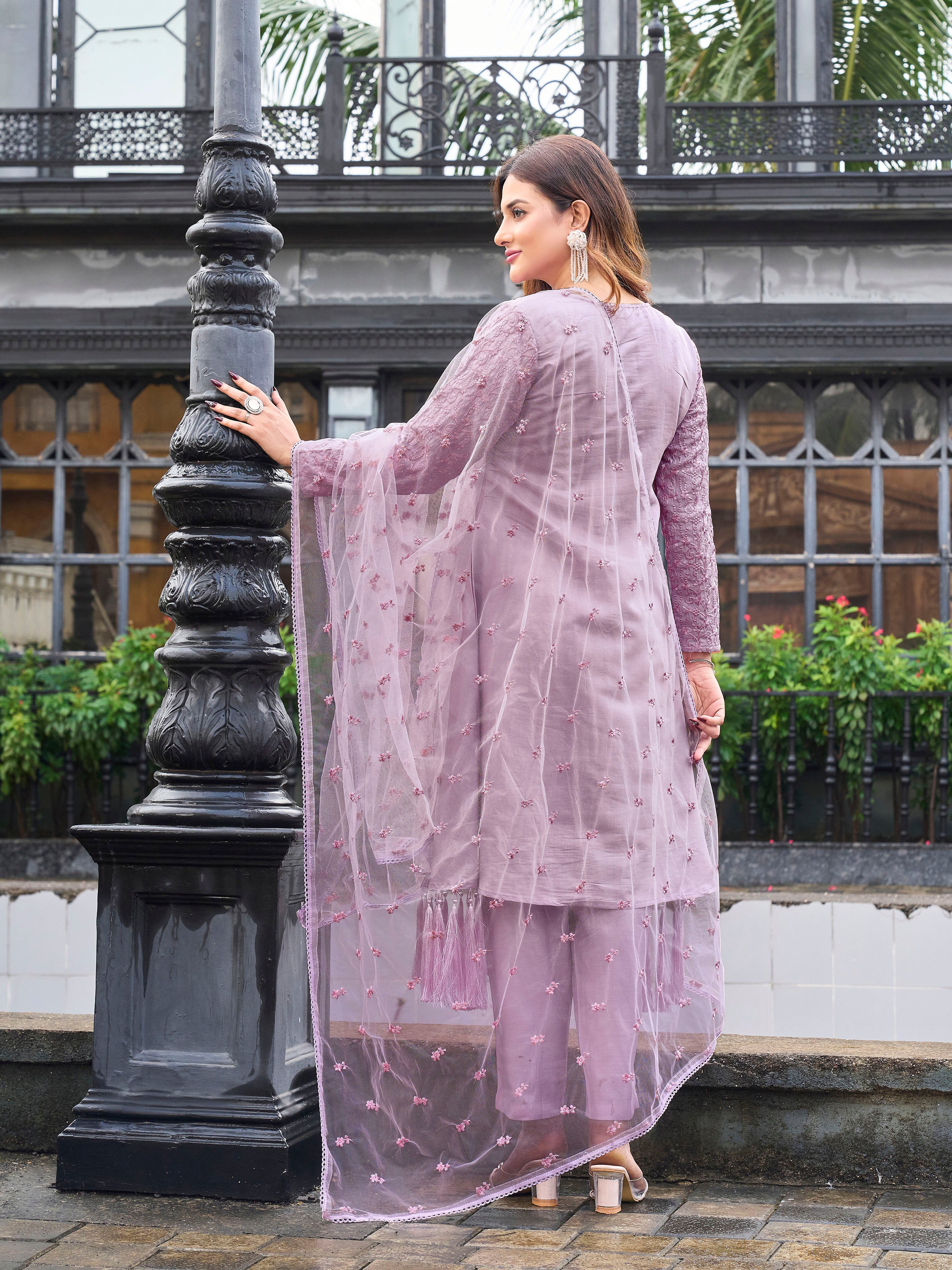 Mauve color silk blend with thread embroidered on sleeves & tassels on heamline kurta & trouser with dupatta set