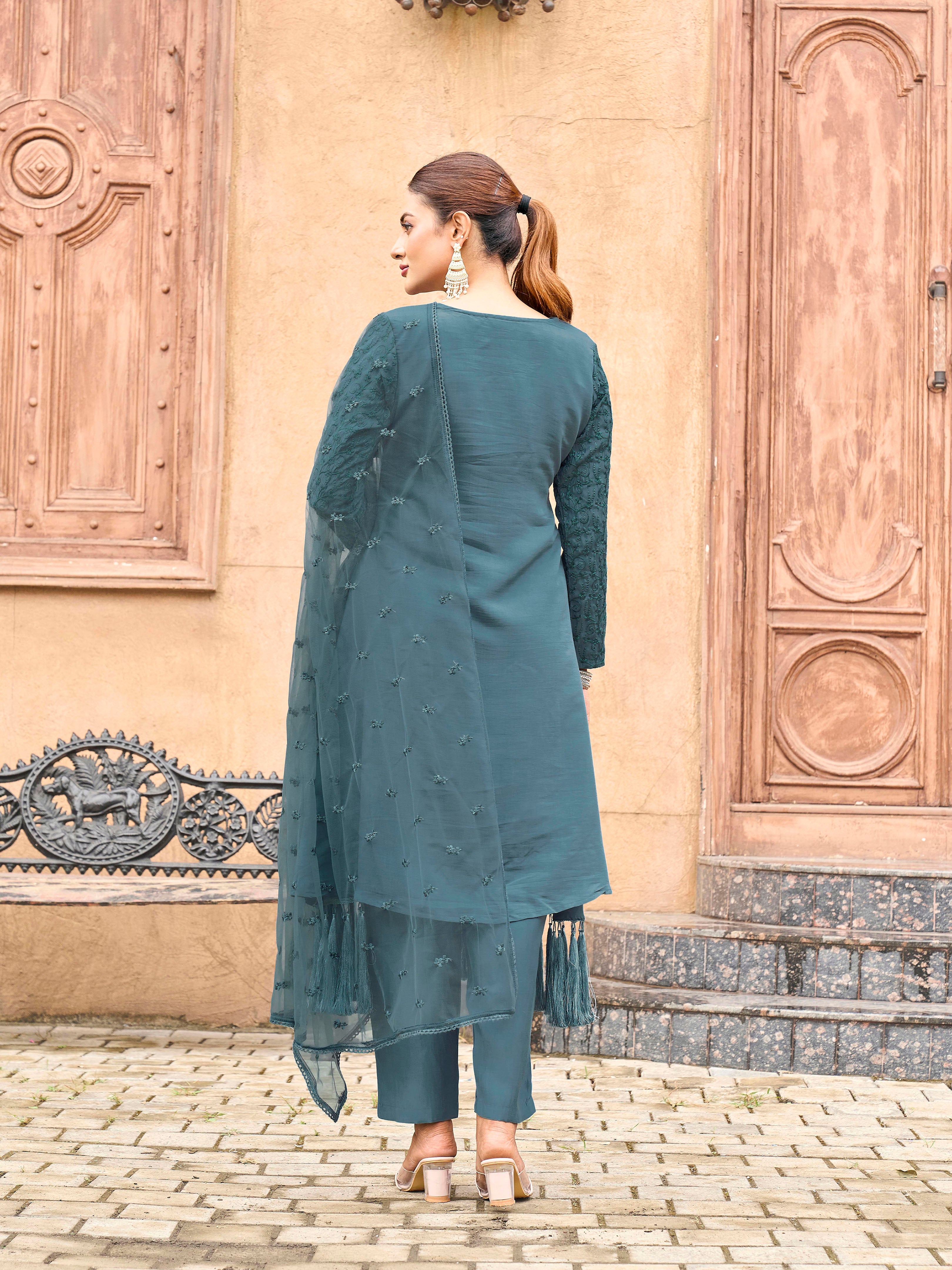 Burnt Blue color silk blend with thread embroidered on sleeves & tassels on heamline kurta & trouser with dupatta set