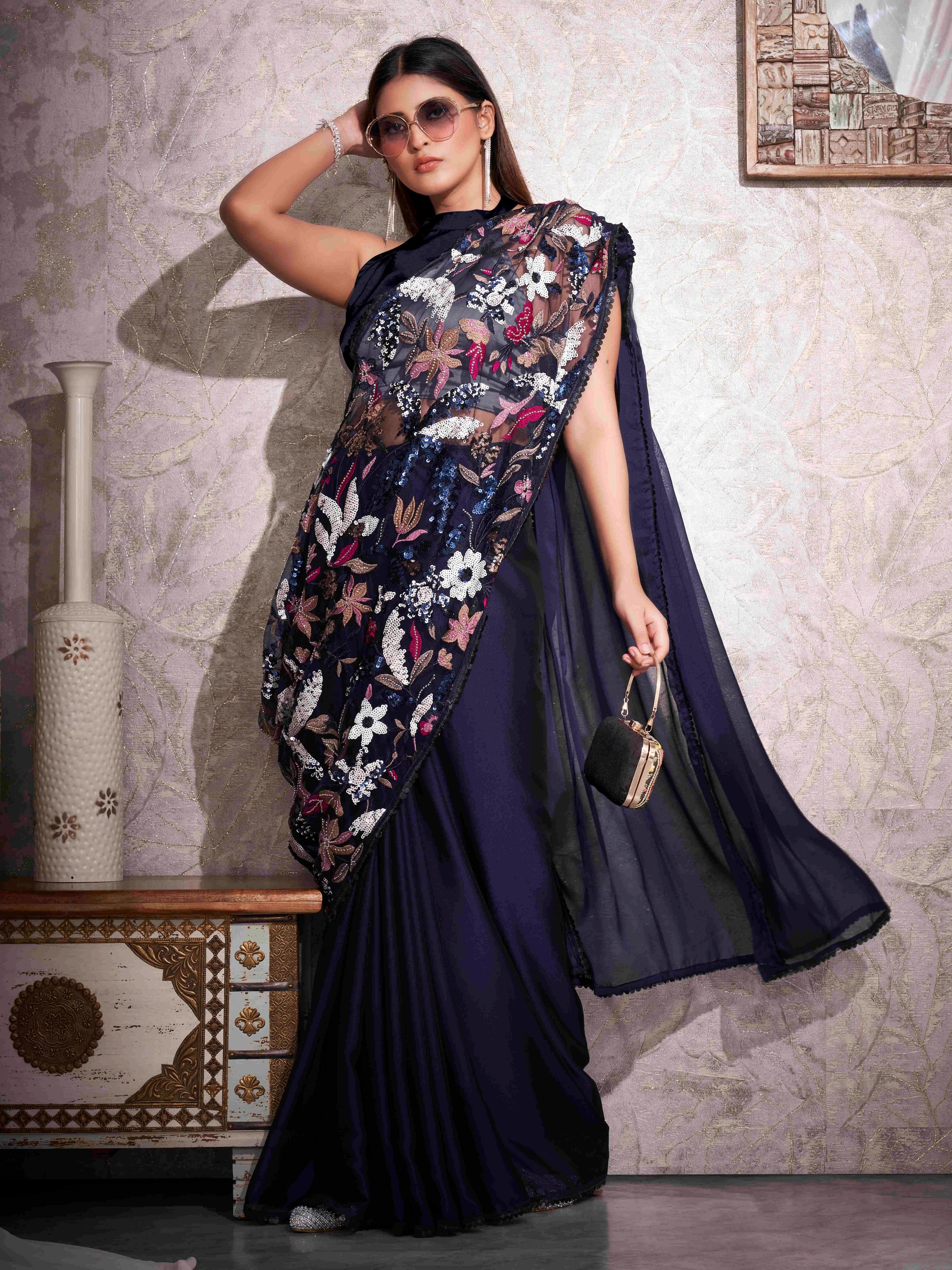 Blue colored designer saree with heavy embroidery on shoulder portion