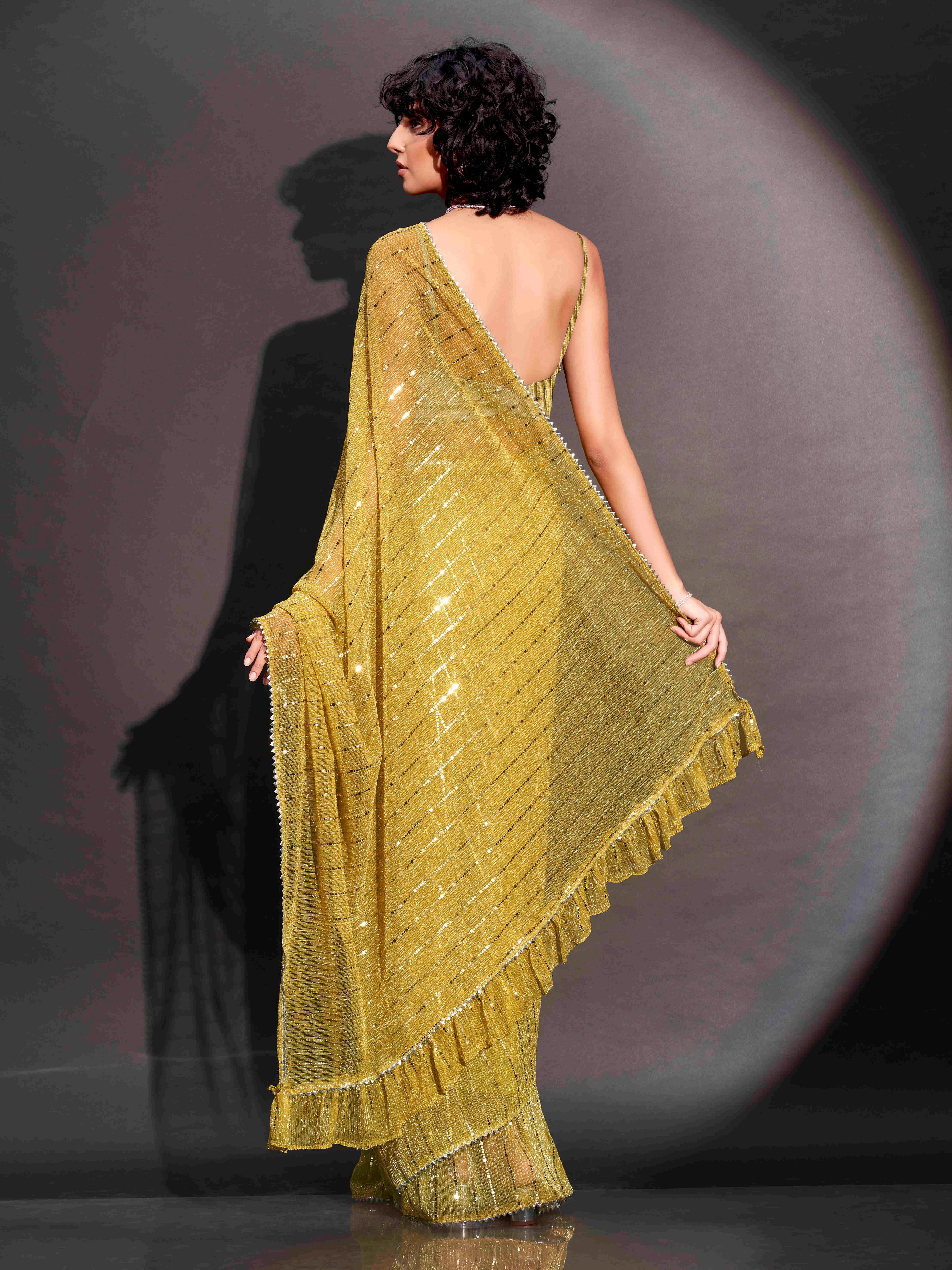 Ready to wear yellow colored lycra saree with foil embellishments and frill on pallu