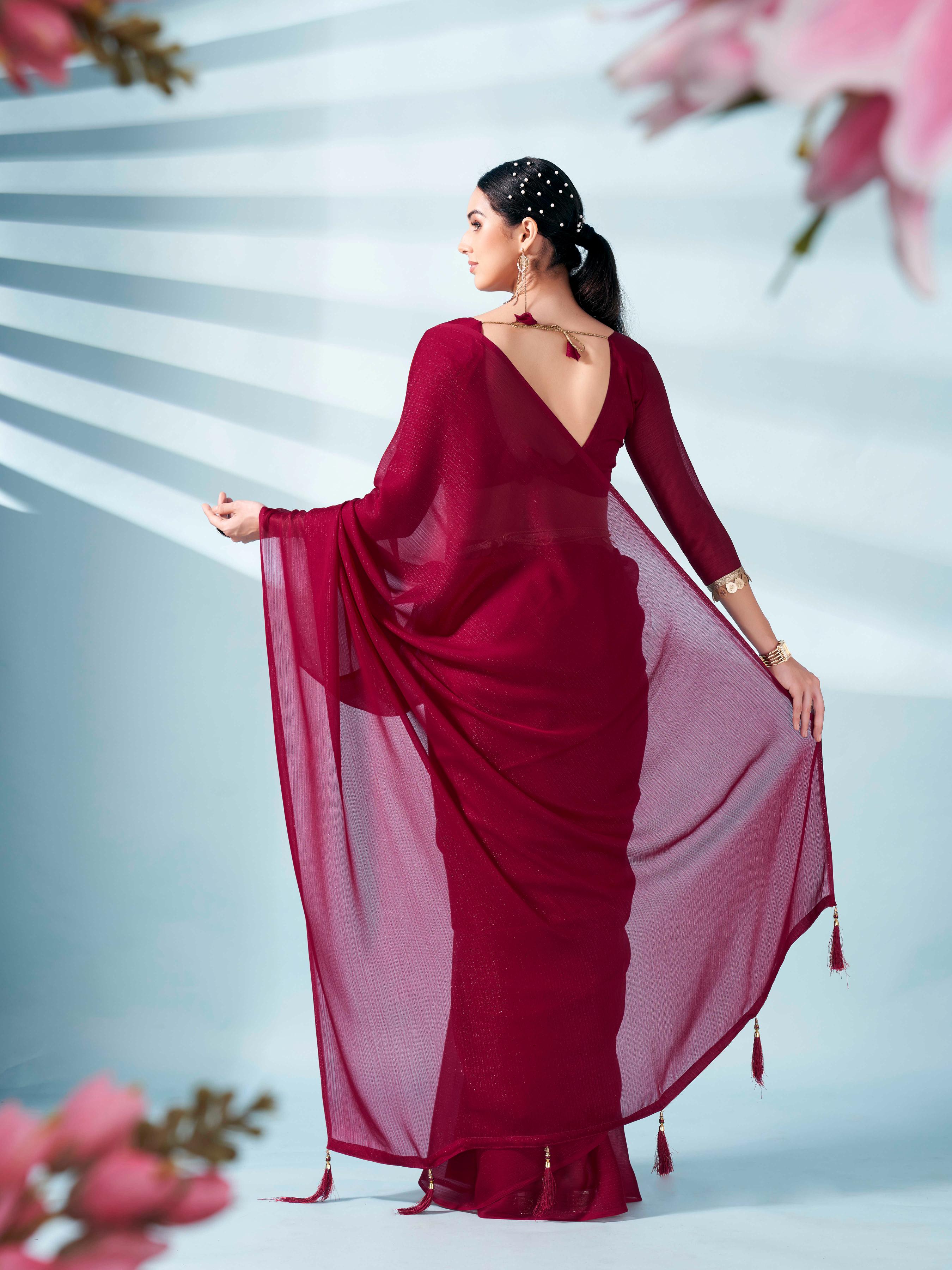 Maroon colored zari weaving satin saree with sequinned belt