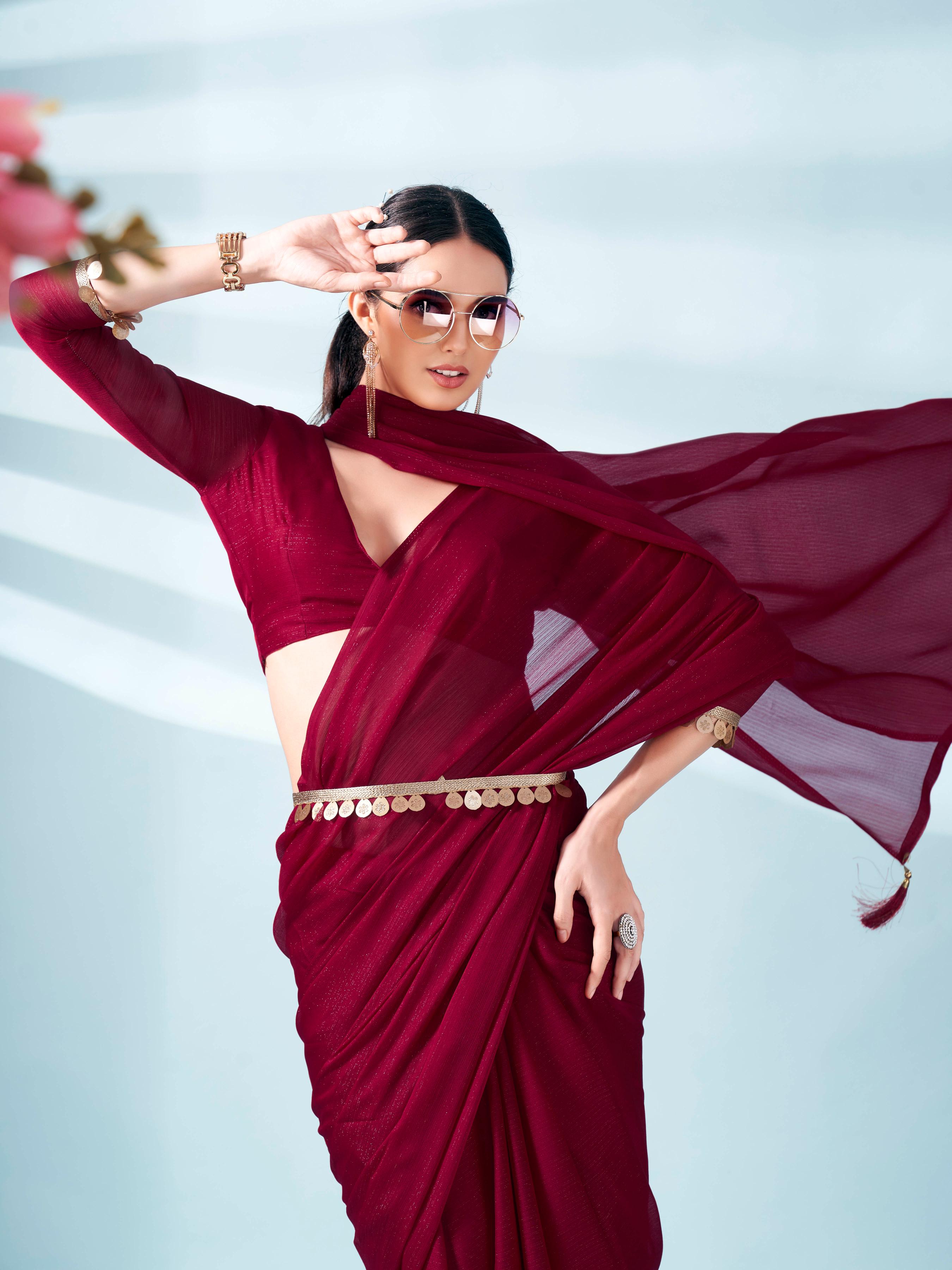 Maroon colored zari weaving satin saree with sequinned belt