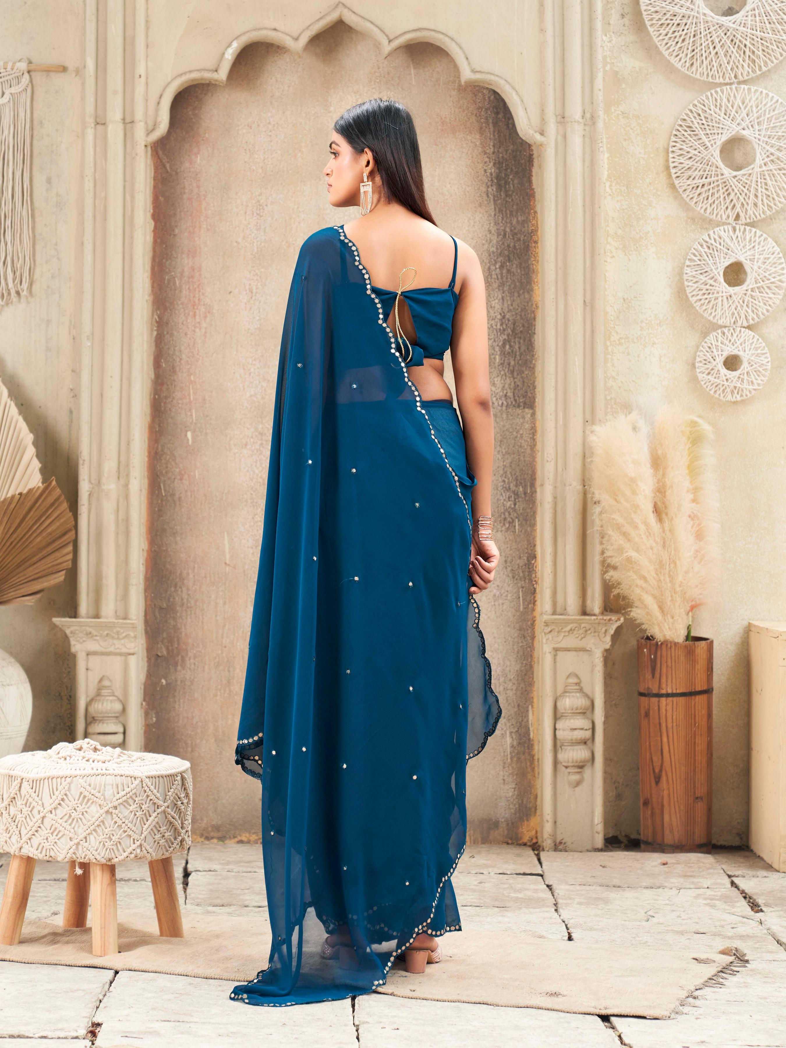 Blue colored organza saree with embellished work