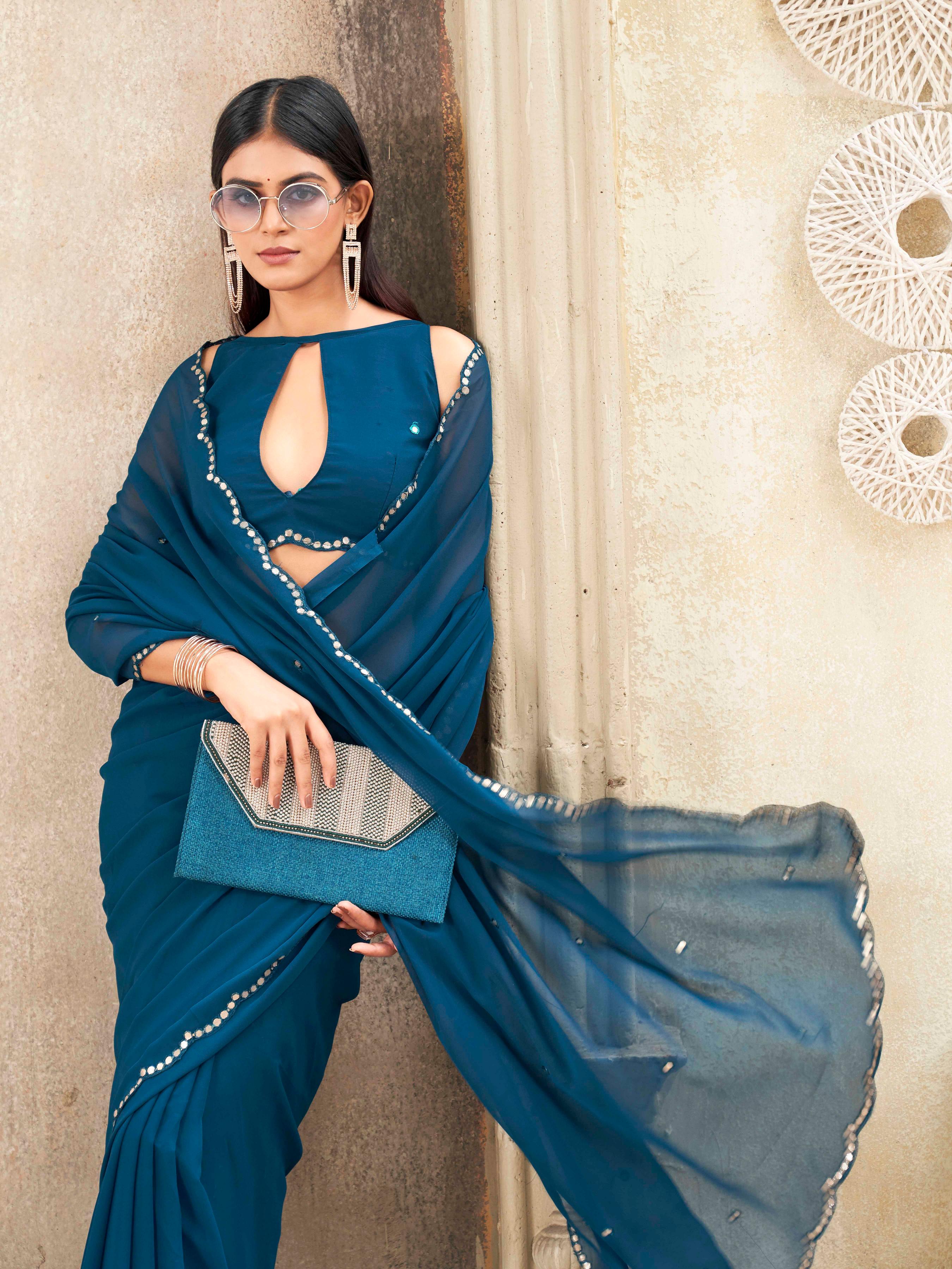Blue colored organza saree with embellished work