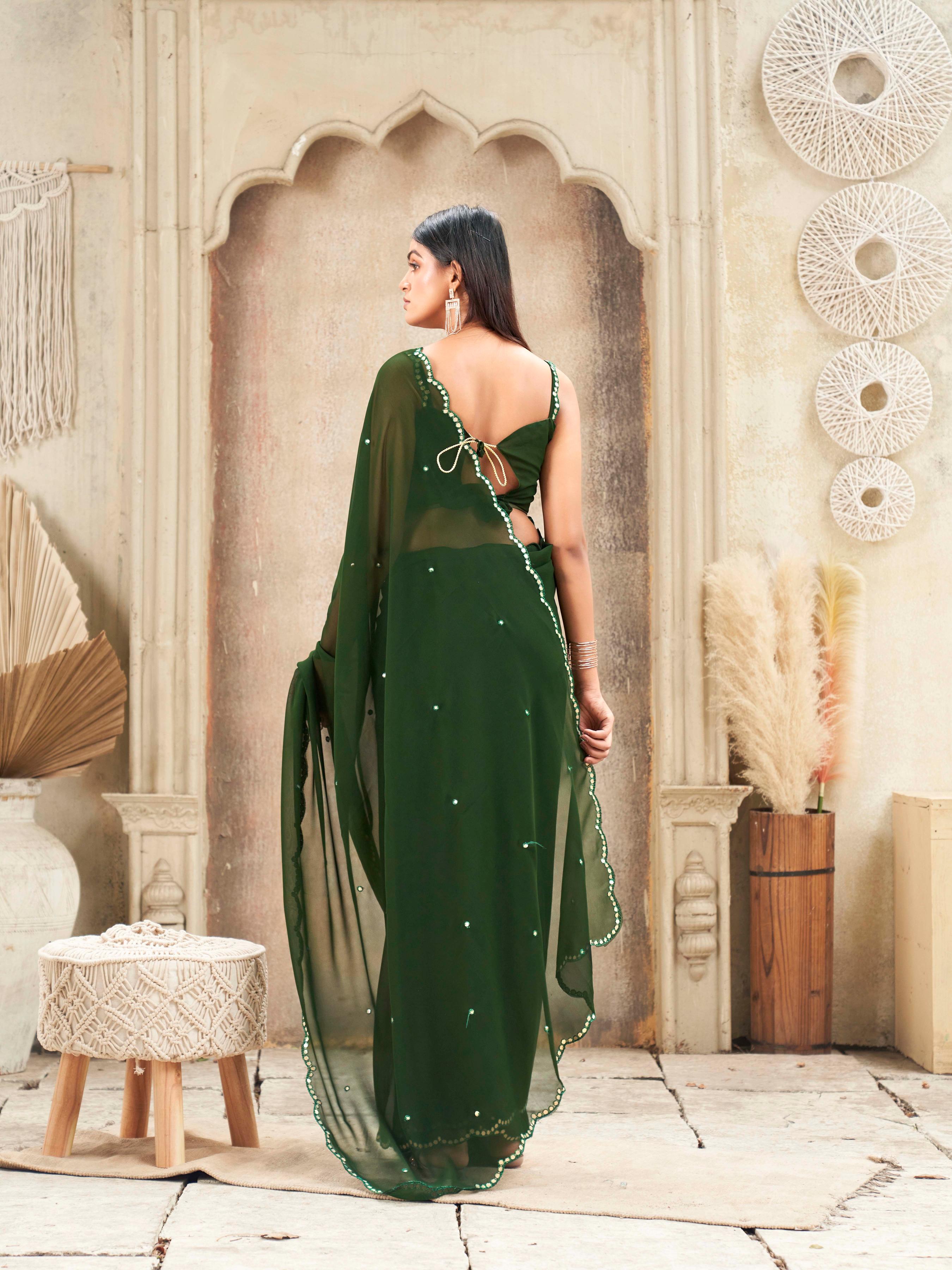 Green colored organza saree with embellished work