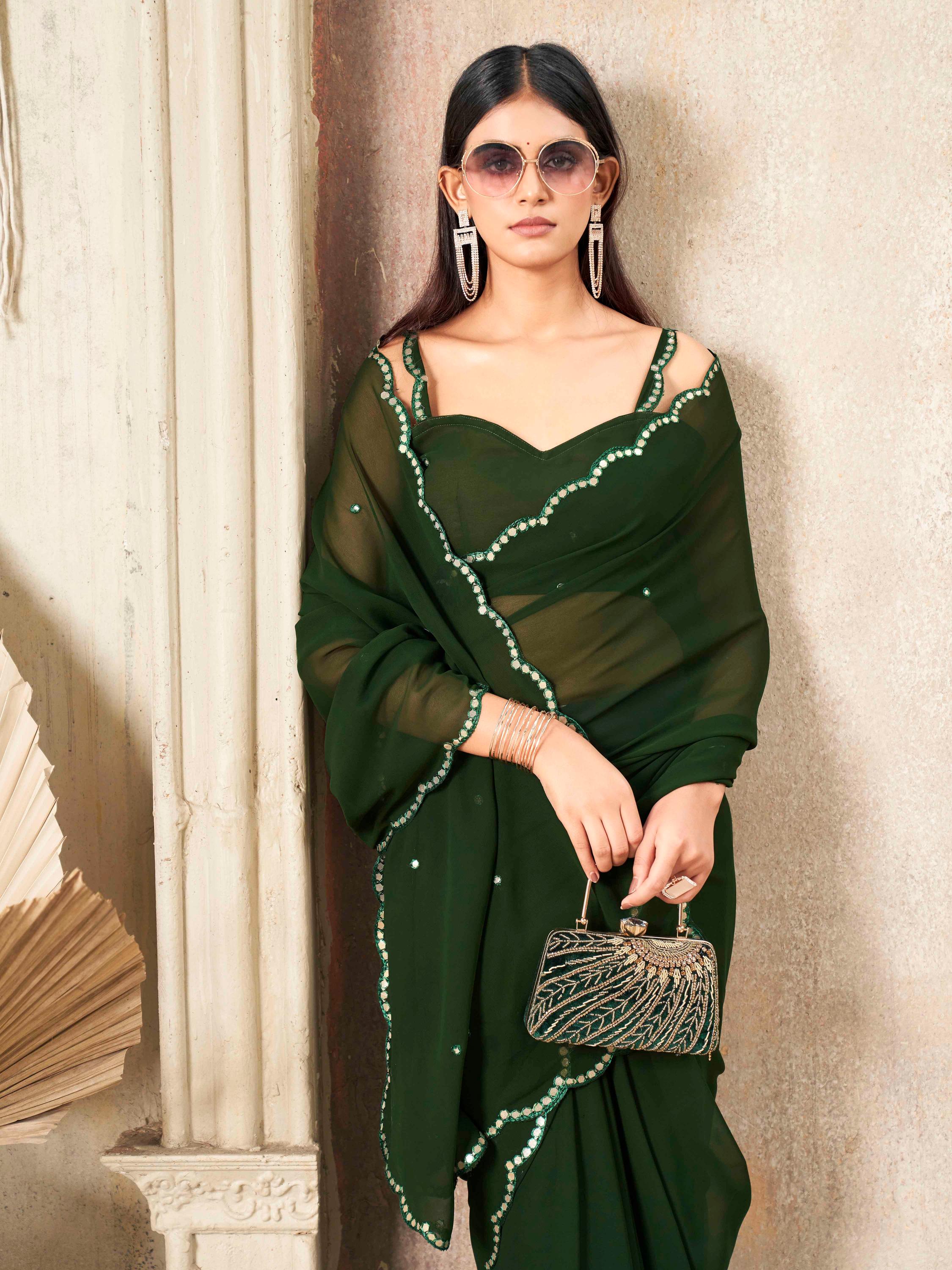 Green colored organza saree with embellished work