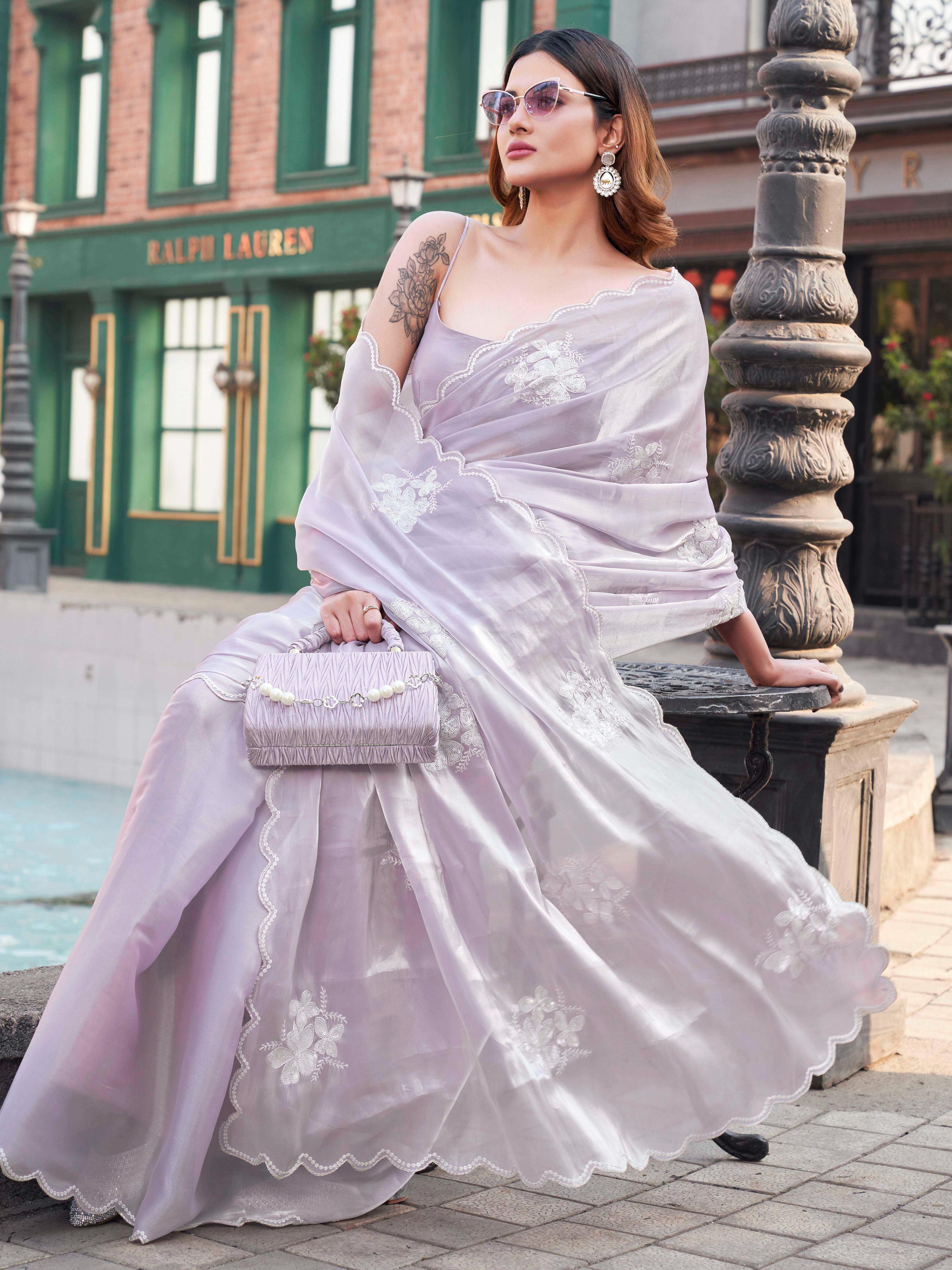 Lavendar colored burbery satin saree with sequinned embroidered butta on pallu and scalloped border