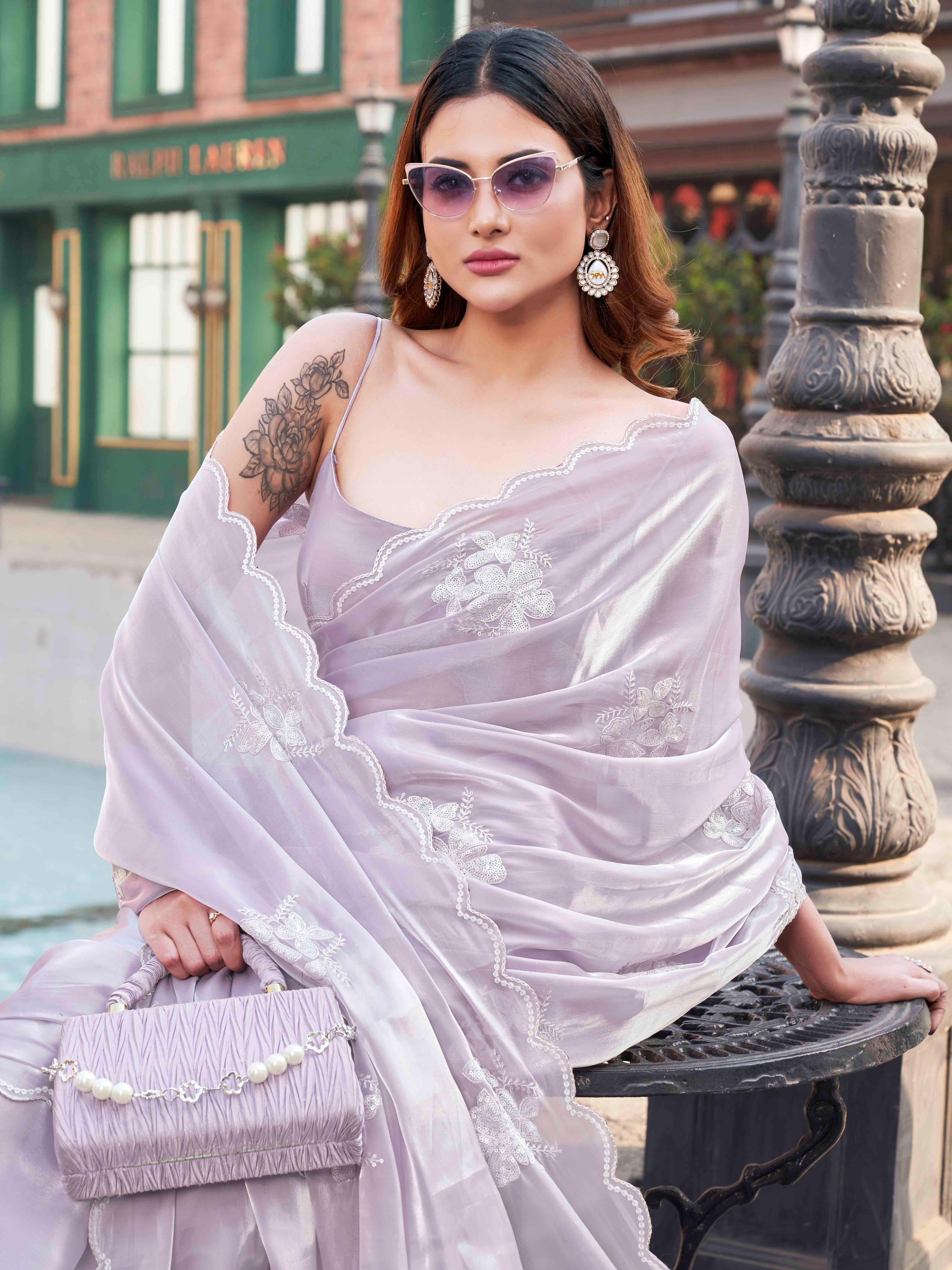 Lavendar colored burbery satin saree with sequinned embroidered butta on pallu and scalloped border