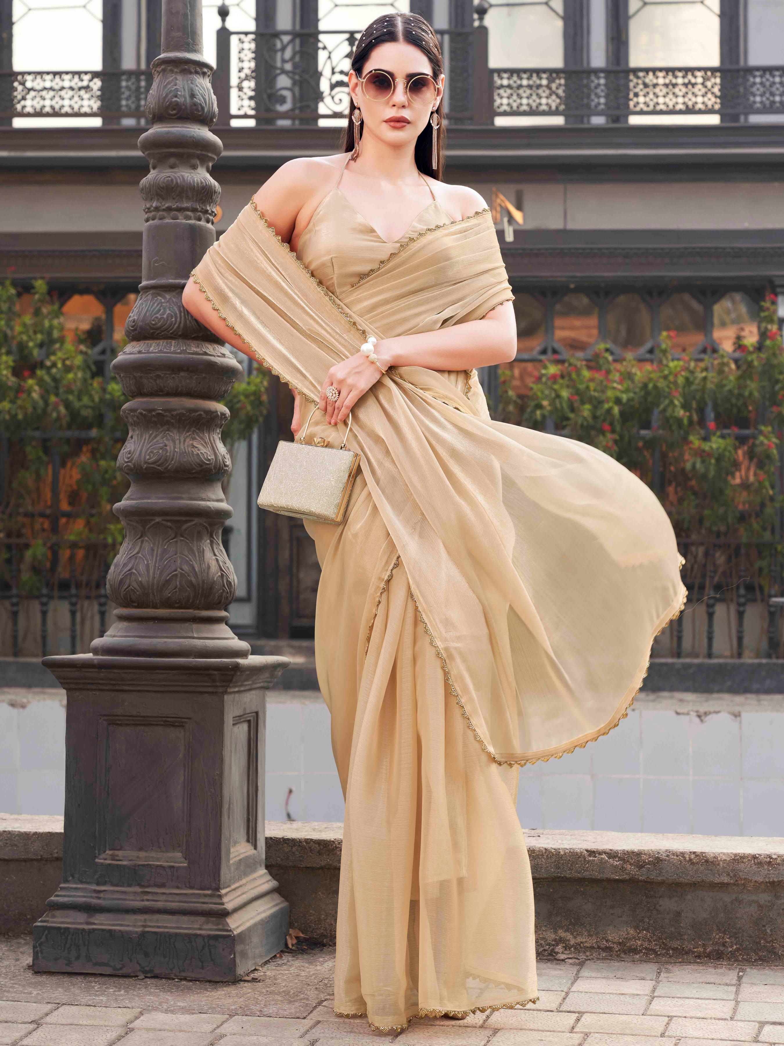 Beige colored jimy cho saree with handwork border