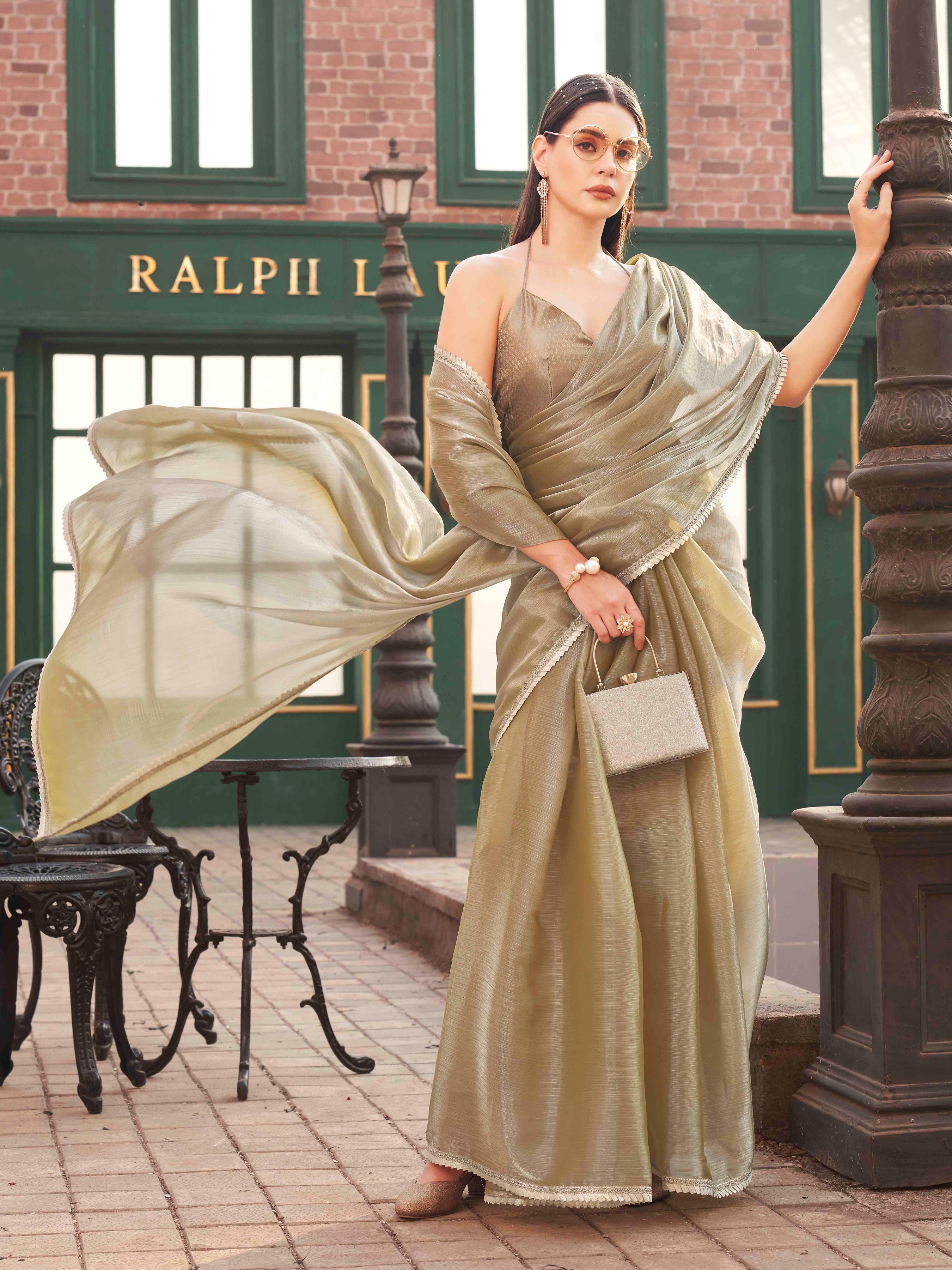 Metallic Green colored jimmy choo saree with brocade blouse