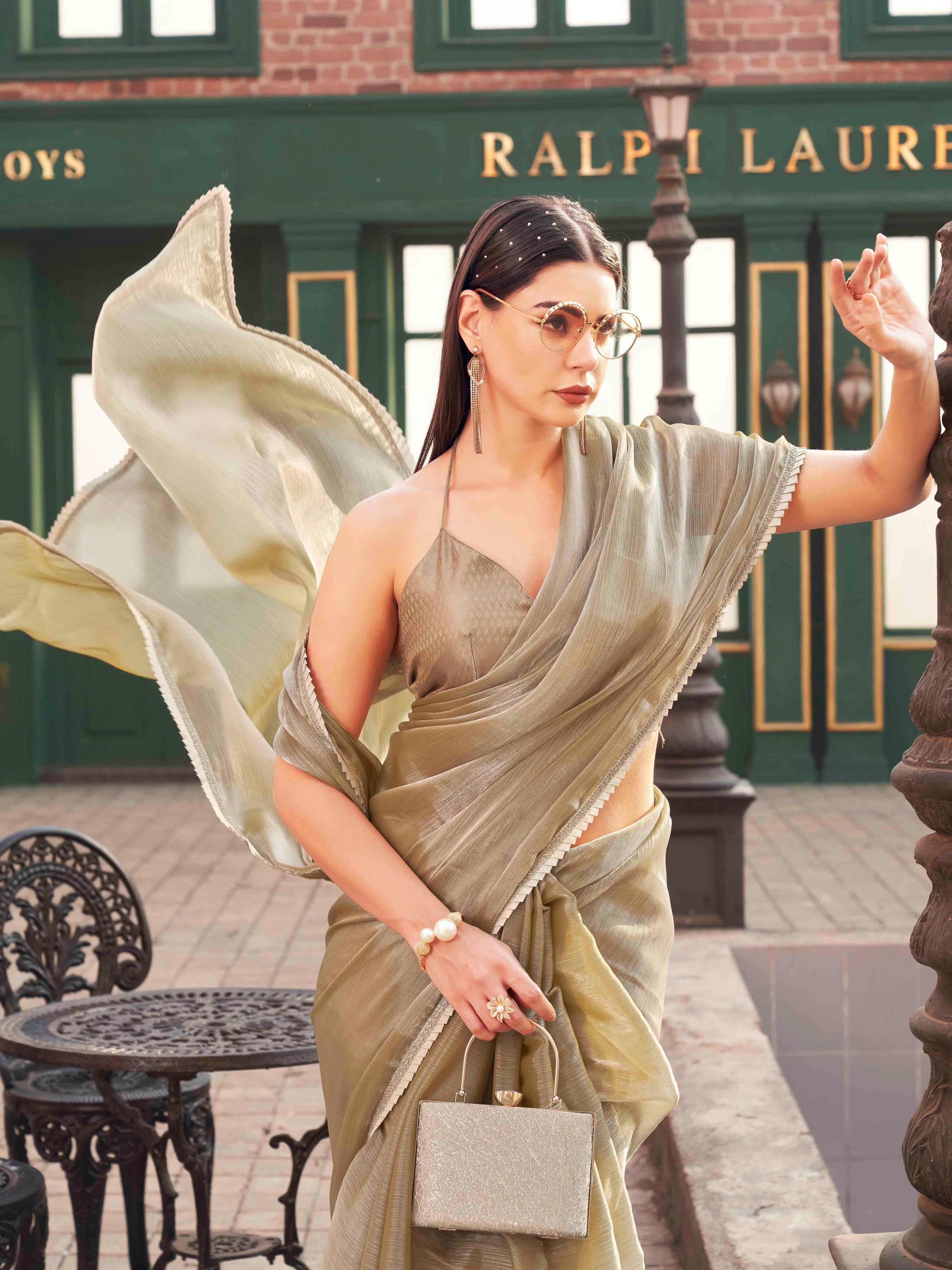 Metallic Green colored jimmy choo saree with brocade blouse
