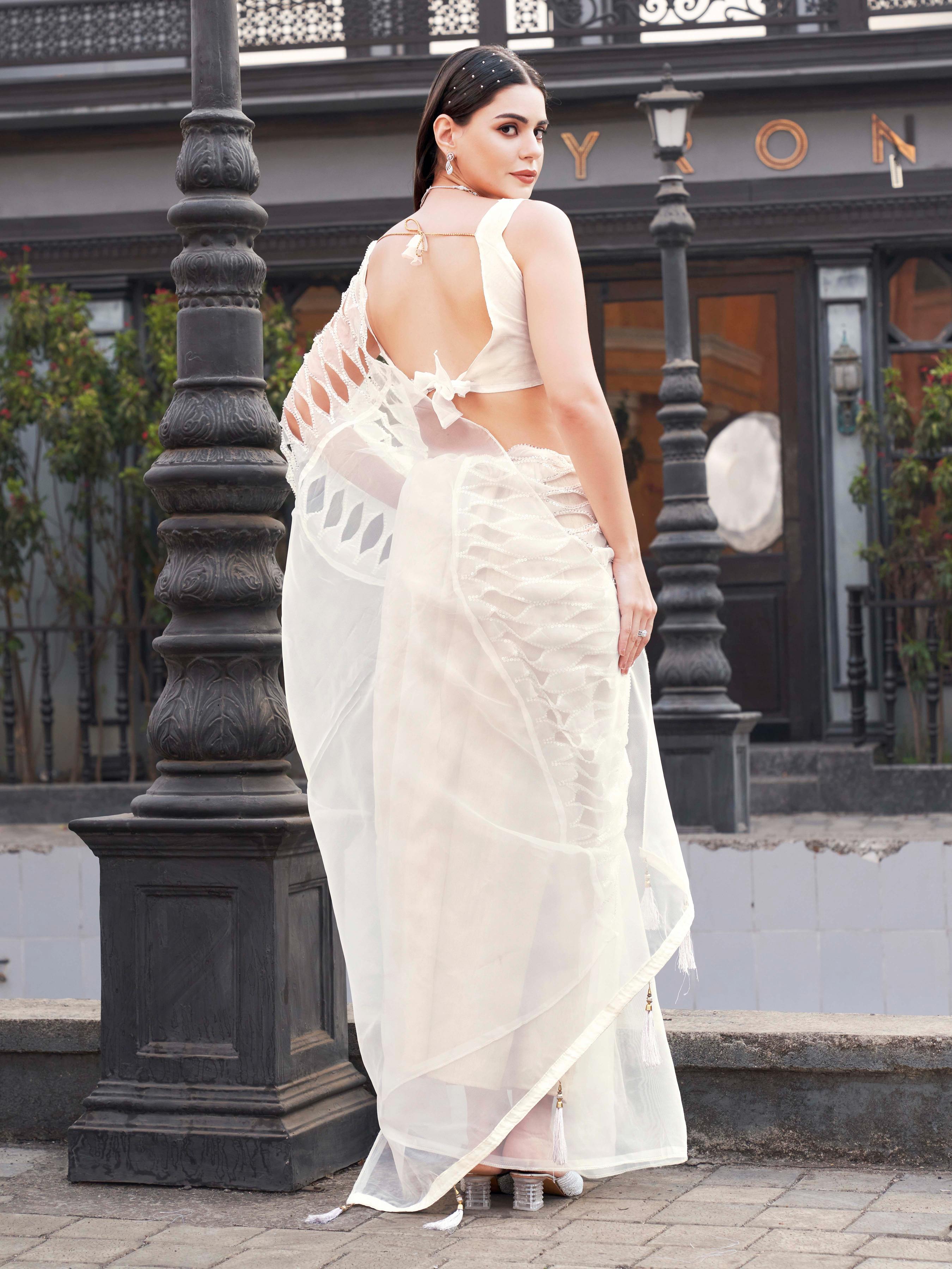 White colored designer organza saree with heavy cutwork fabric on shoulder