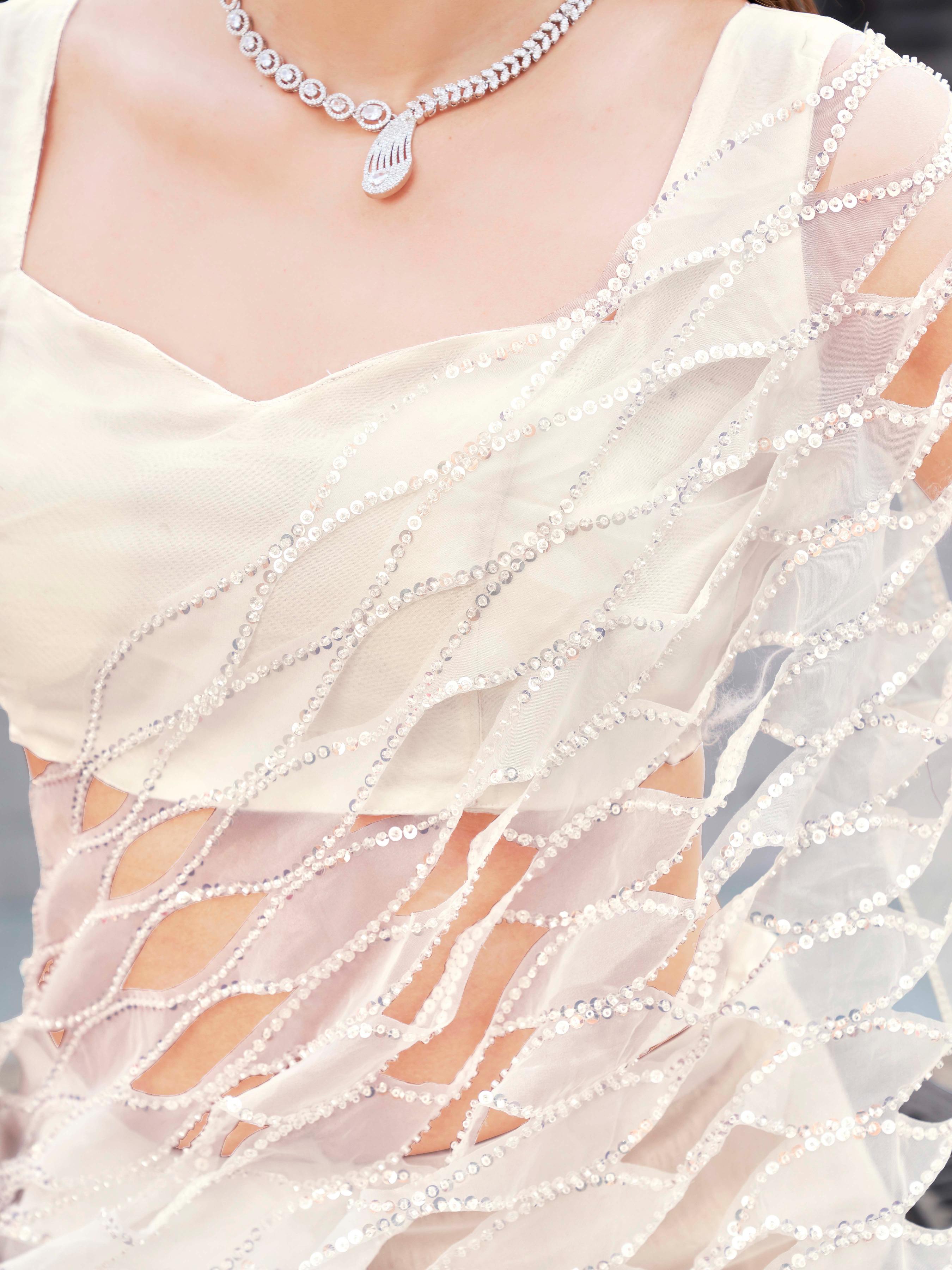 White colored designer organza saree with heavy cutwork fabric on shoulder