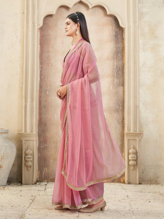 Pink colored chiffon saree with embellished lace and brocade blouse