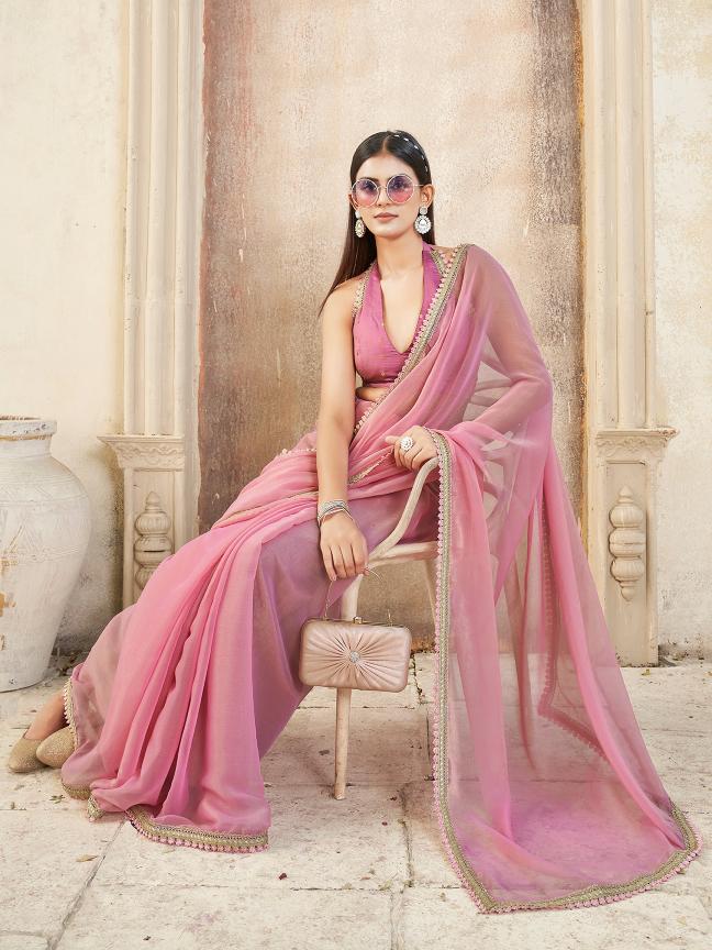 Pink colored chiffon saree with embellished lace and brocade blouse