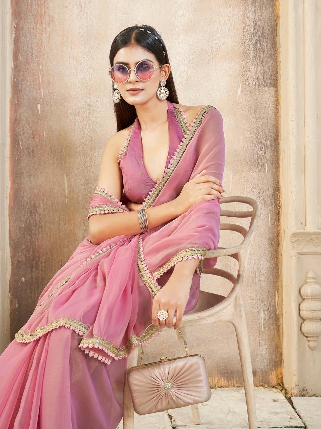 Pink colored chiffon saree with embellished lace and brocade blouse
