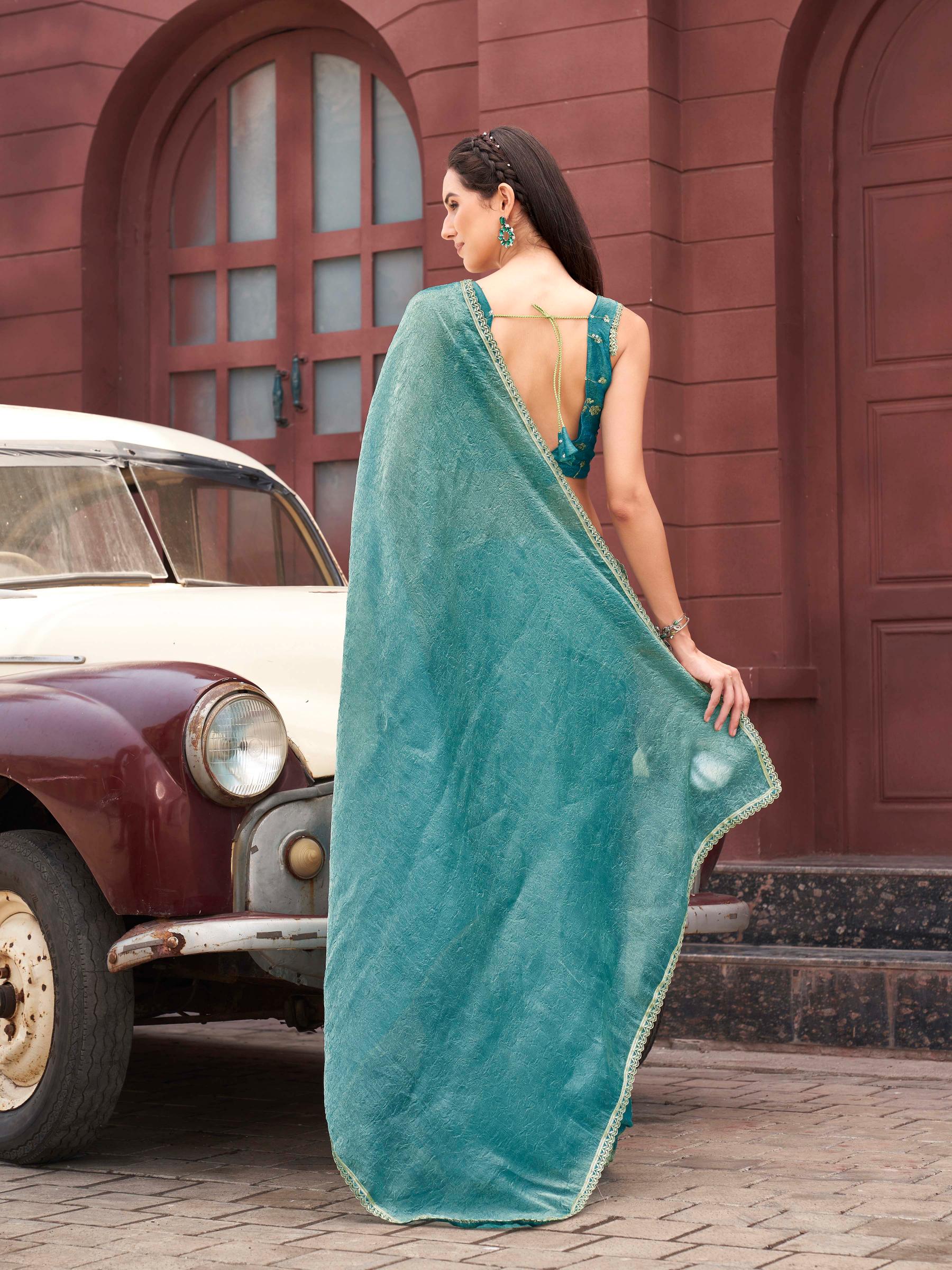 Two toned blue and gold colored wrinkled saree with embroidered blouse and embellished lace