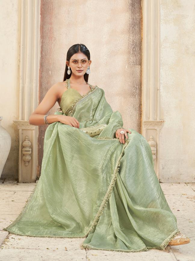 Pista green colored crunchy saree with sequinned lace and brocade blouse