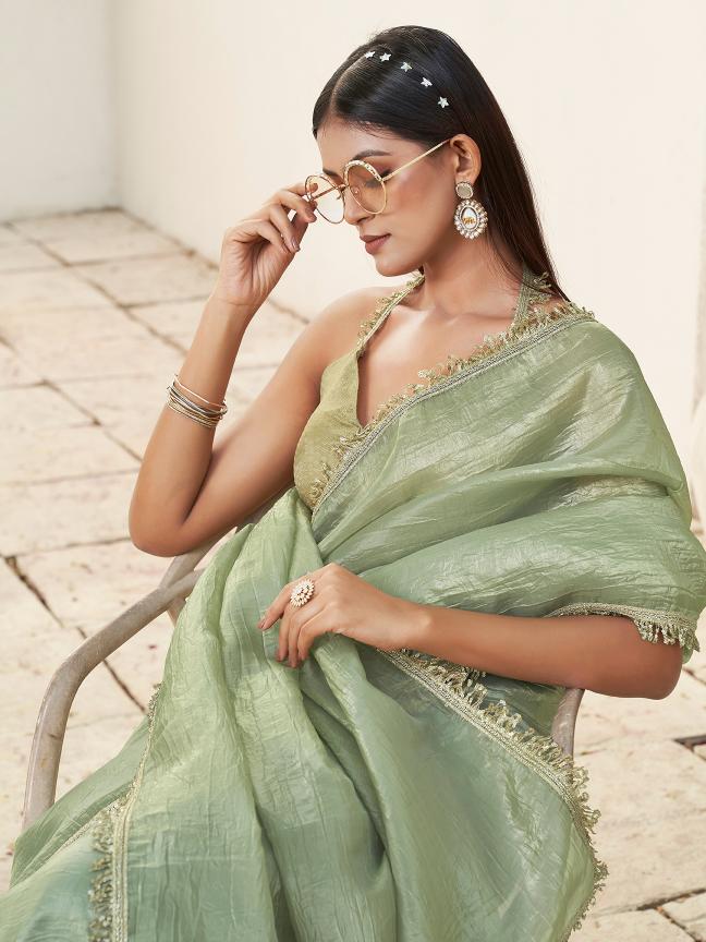 Pista green colored crunchy saree with sequinned lace and brocade blouse