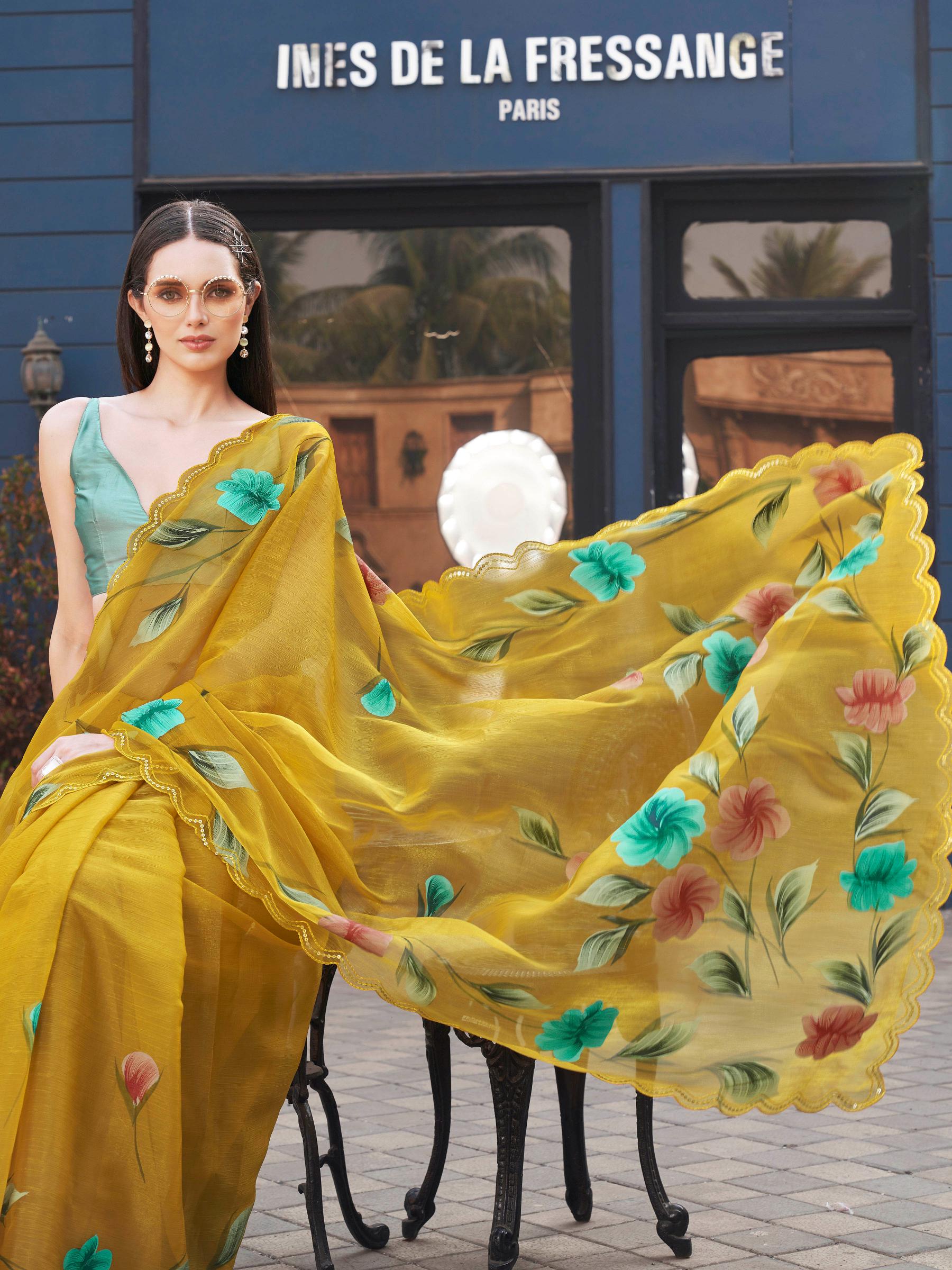 Yellow colored designer floral hand print jimmy choo saree with scalloped border