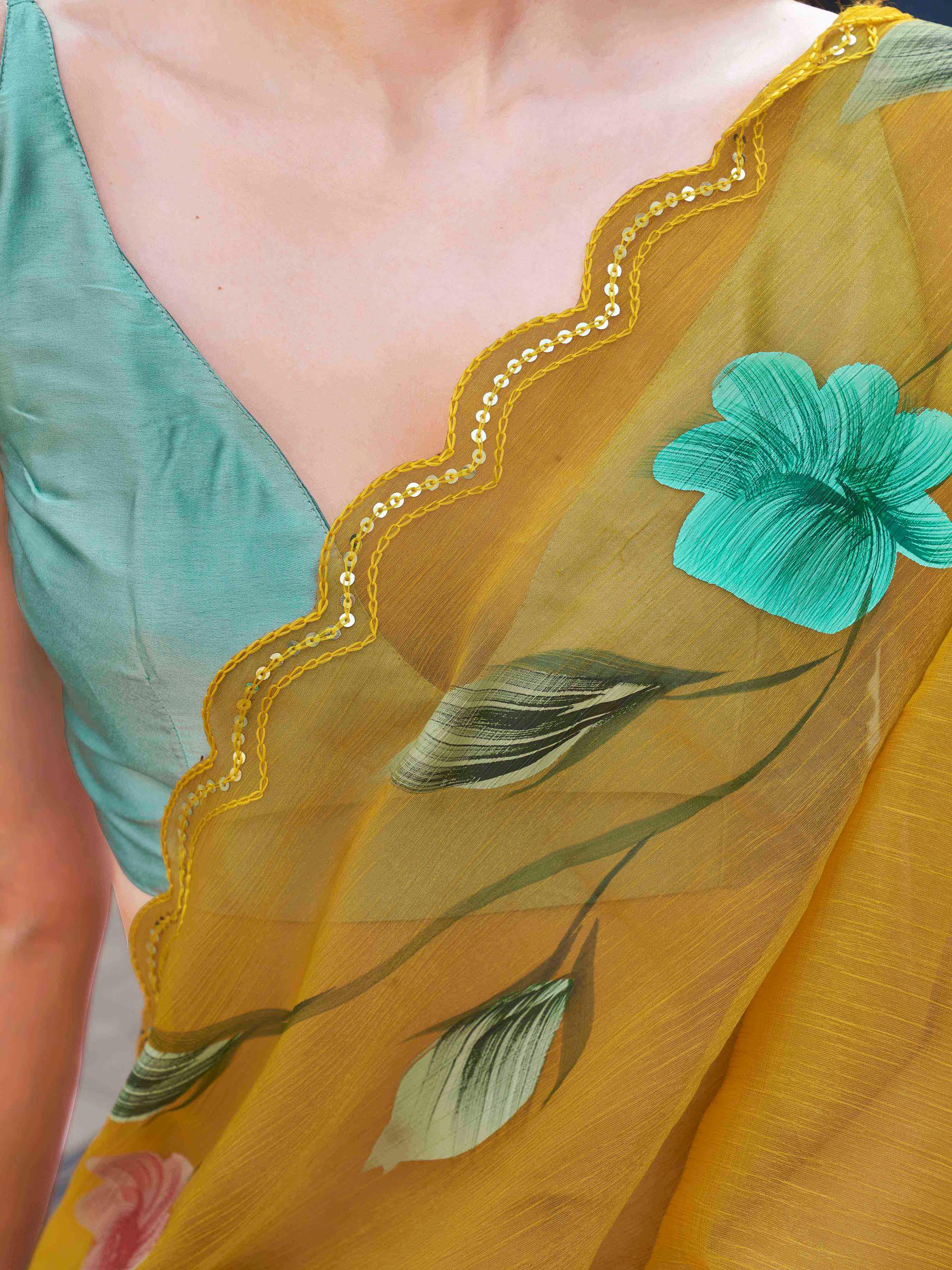 Yellow colored designer floral hand print jimmy choo saree with scalloped border