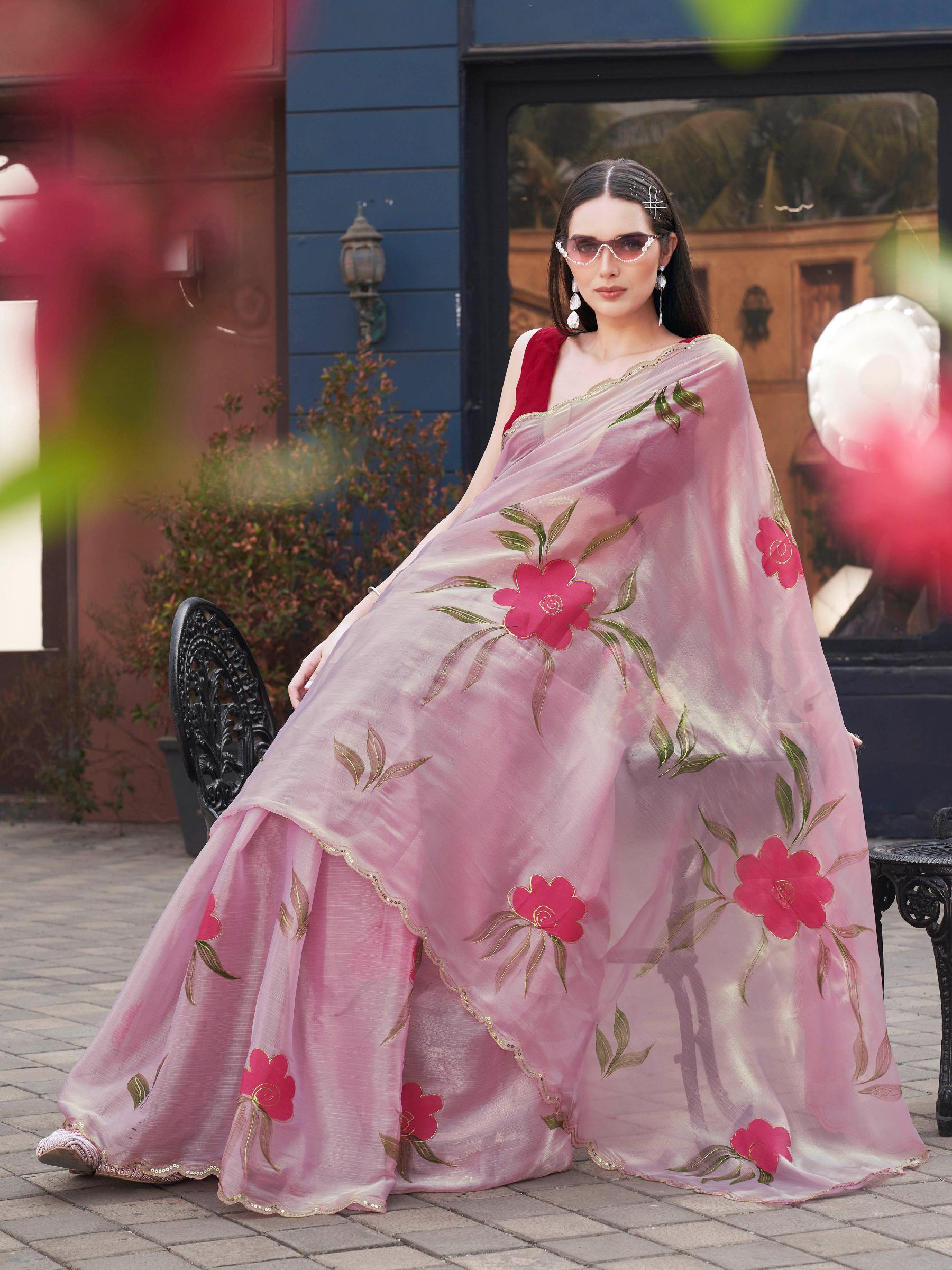 Pink colored designer floral hand print jimmy choo saree with scalloped border