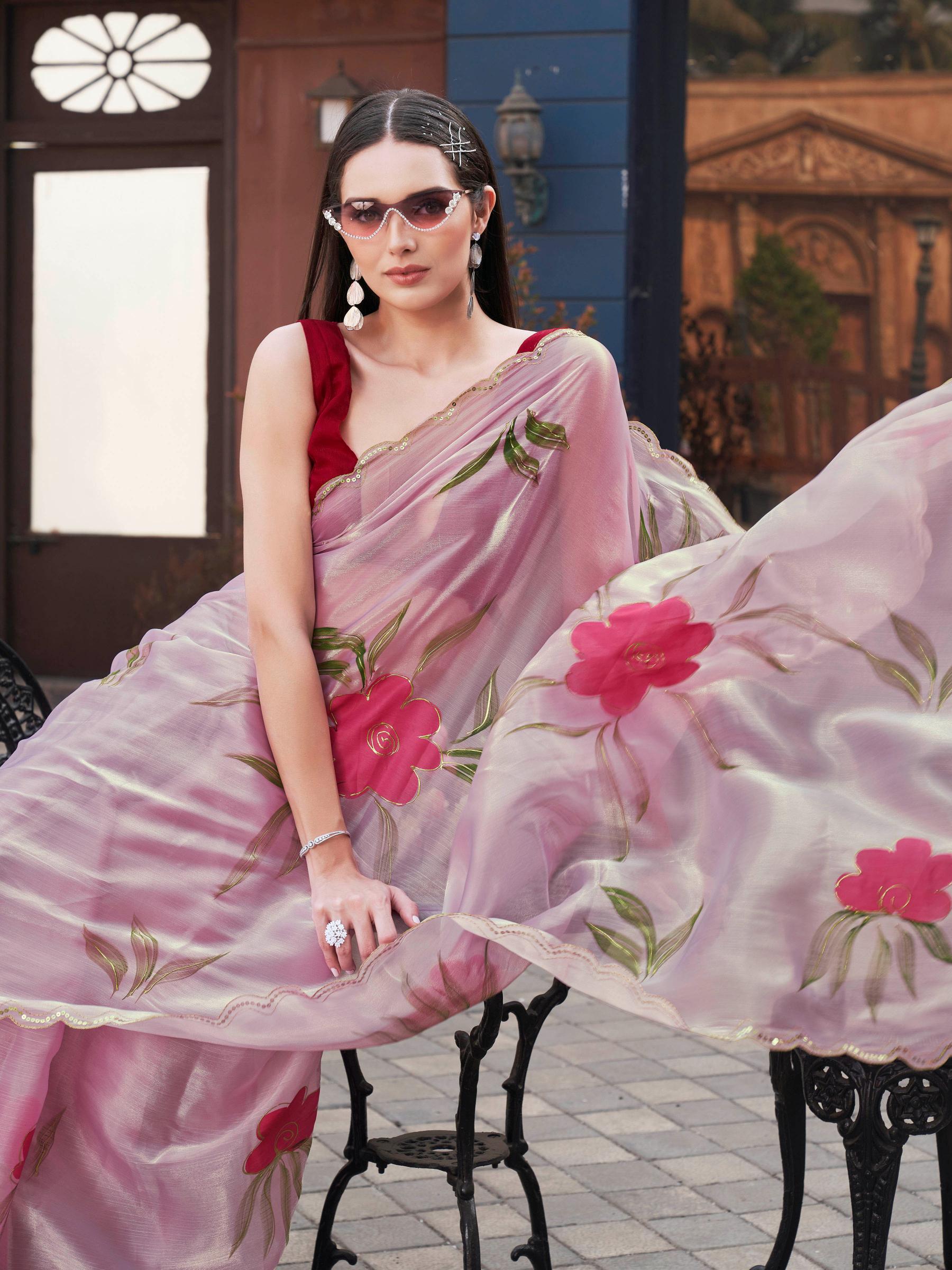 Pink colored designer floral hand print jimmy choo saree with scalloped border