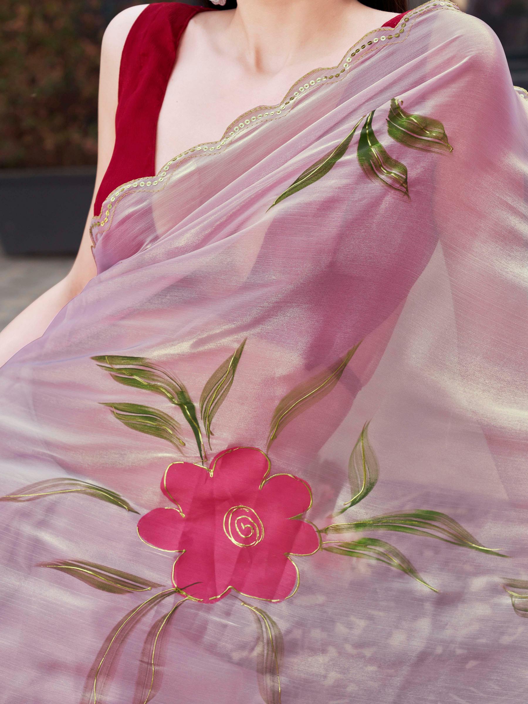 Pink colored designer floral hand print jimmy choo saree with scalloped border