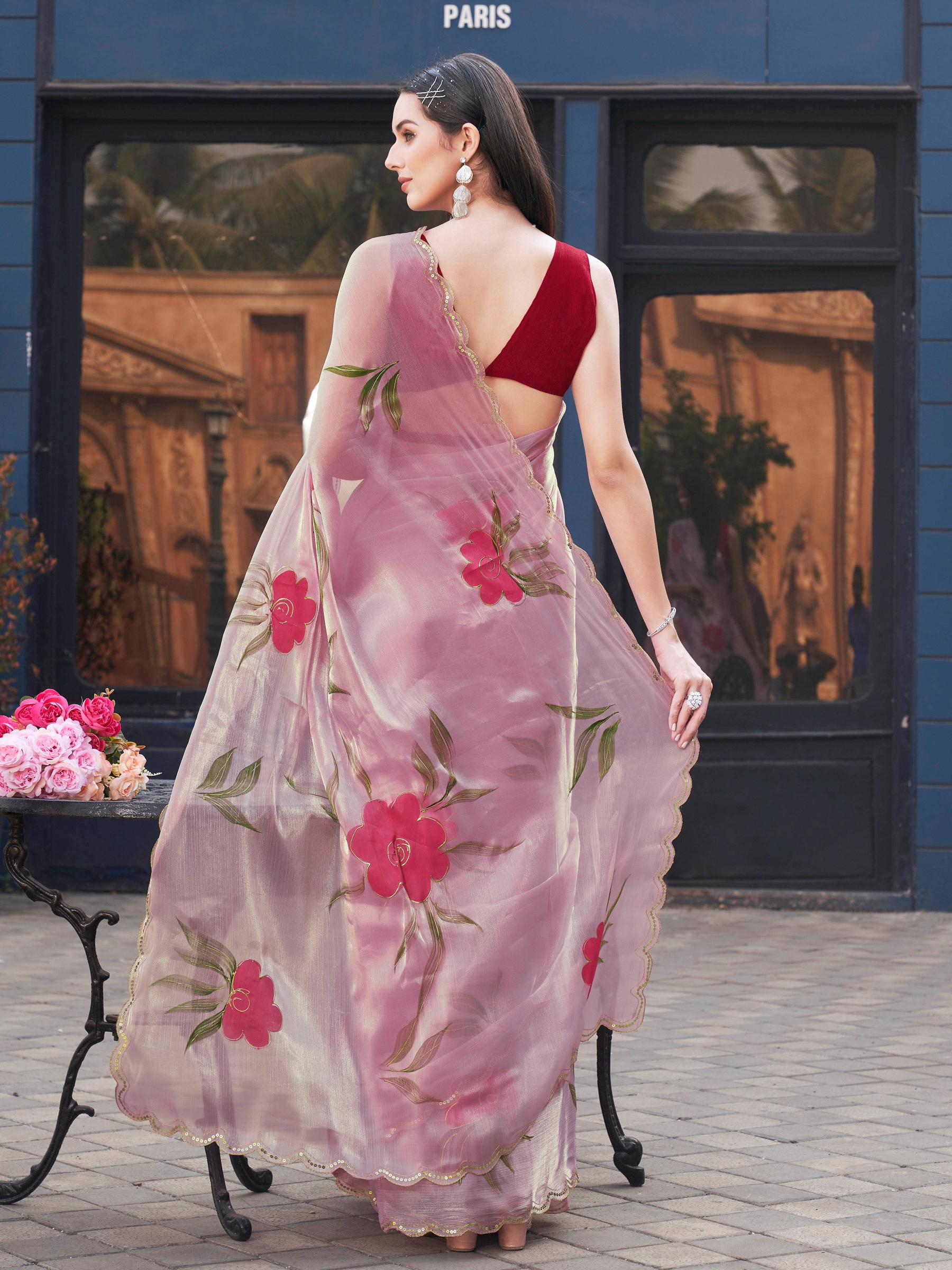 Pink colored designer floral hand print jimmy choo saree with scalloped border