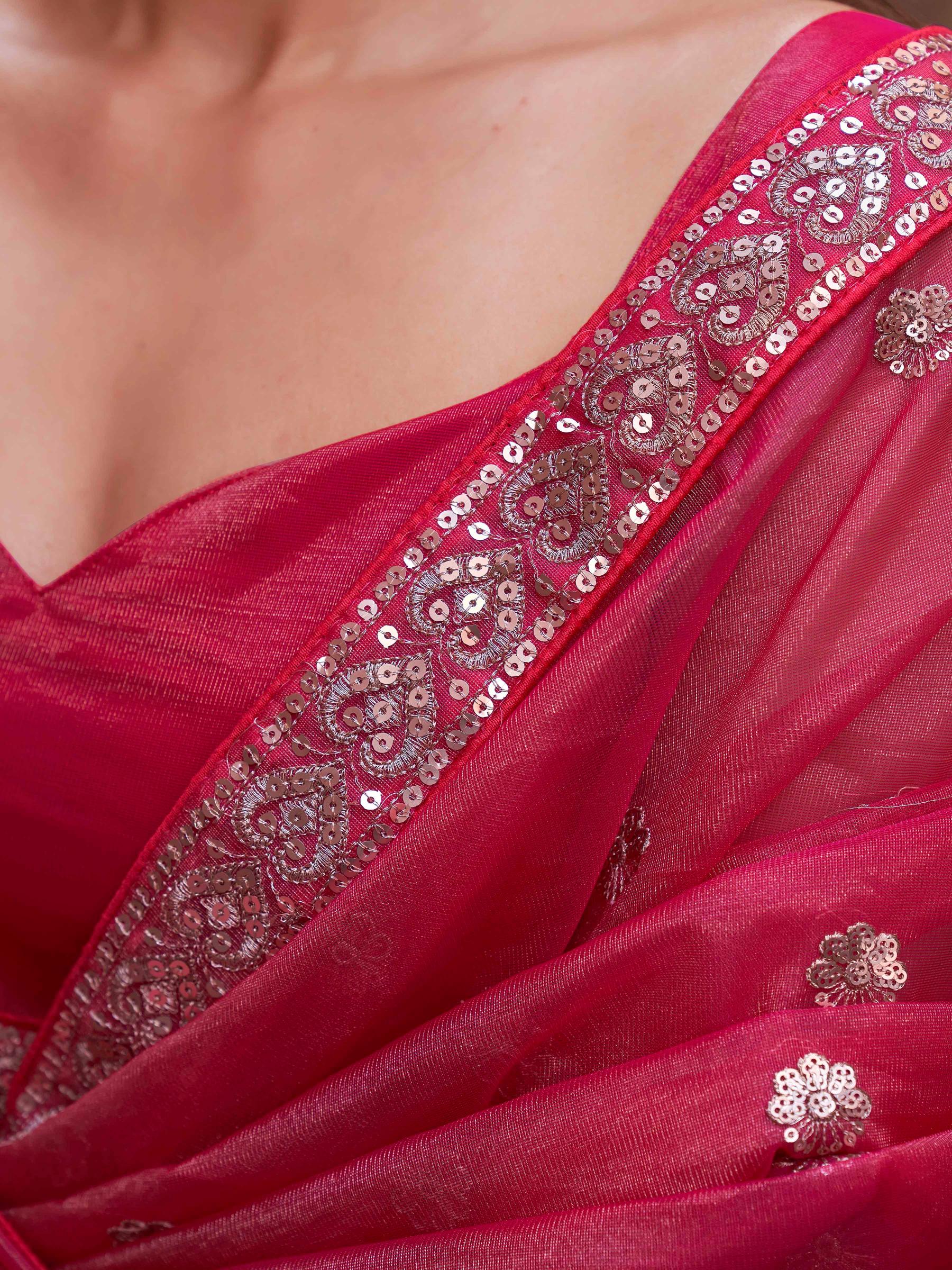 Pink colored net saree with sequence embroidered lace