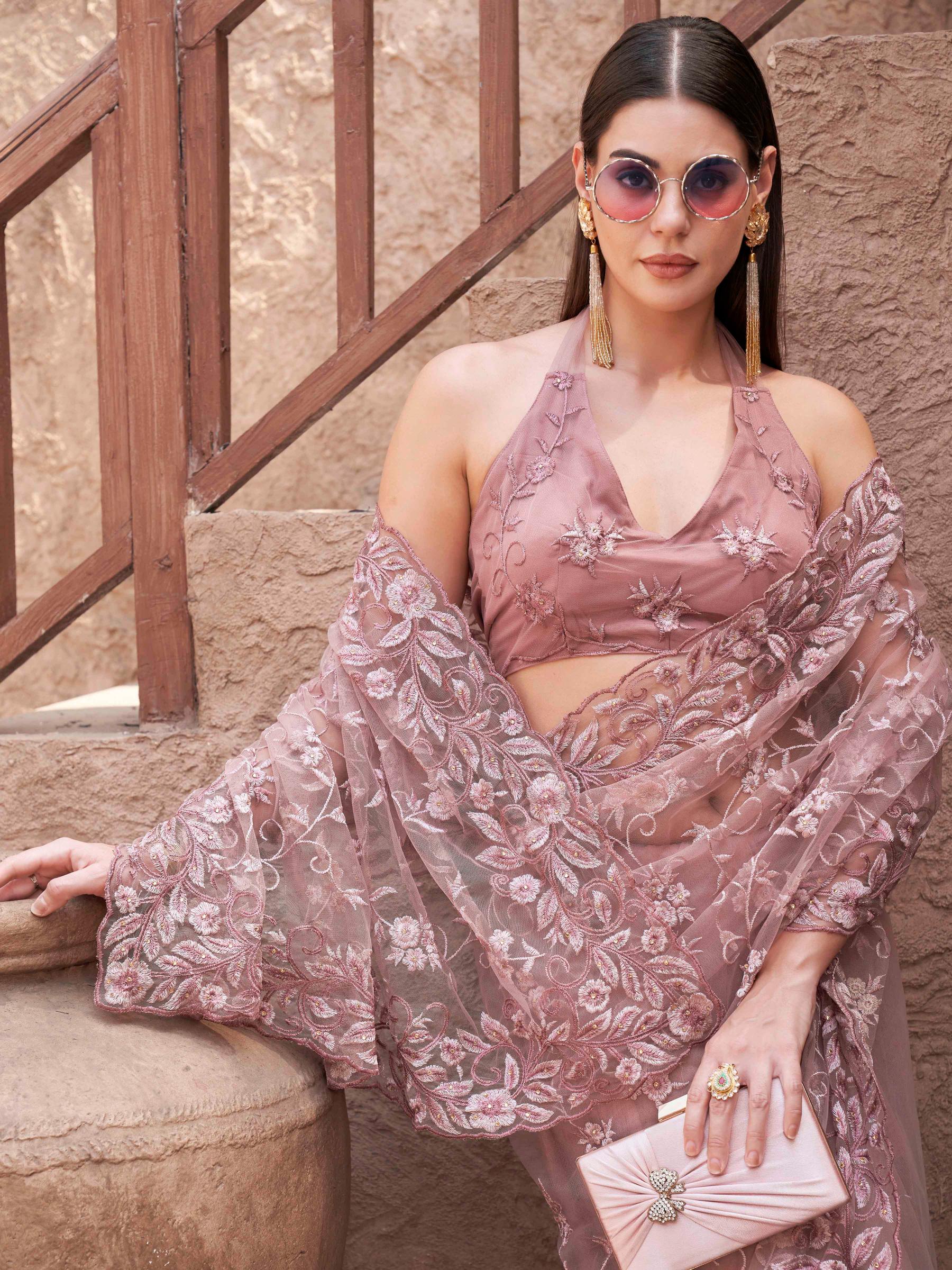 mauve colored embroidered net saree with scalloped border